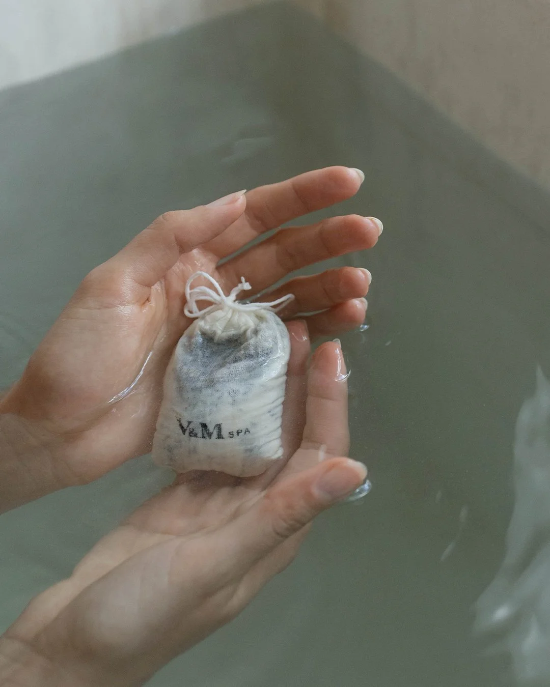 V&M SPA Lavender Bath Milk glass jar with bamboo lid on stone surface — magnesium and lactic acid bath soak for winter restoration and sensitive skin Australia