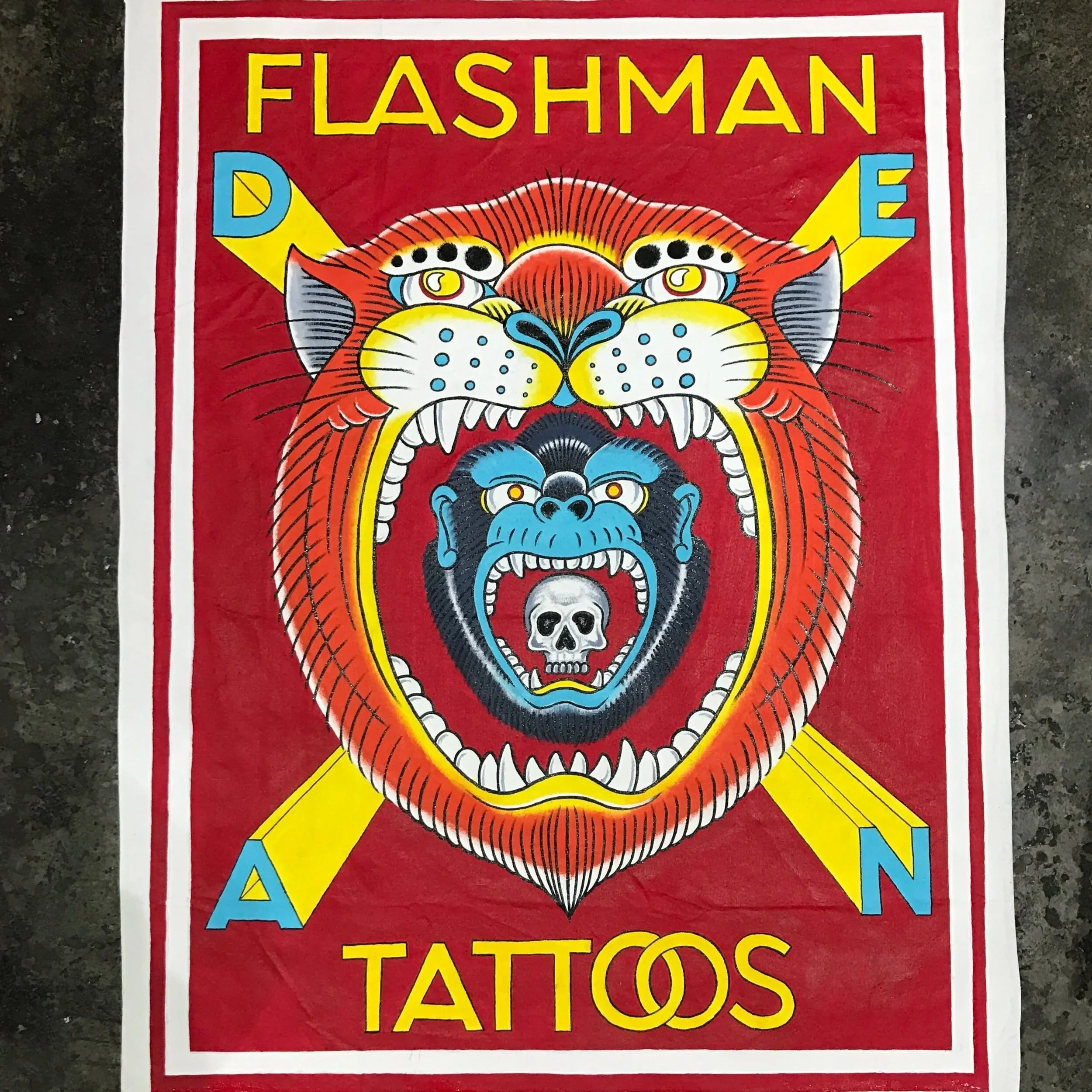 Colorful poster with a fierce tiger and gorilla design, with the words 'Flashman Tattoo' at the top and bottom.