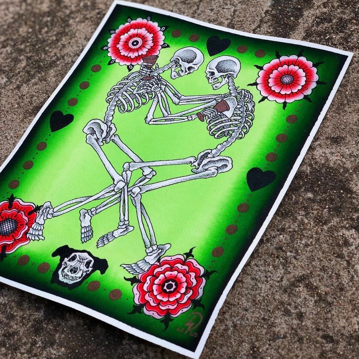 A stylized artwork of two skeletons sitting and holding each other, surrounded by red flowers with dark centers, black hearts, and small brown dots on a bright green background.