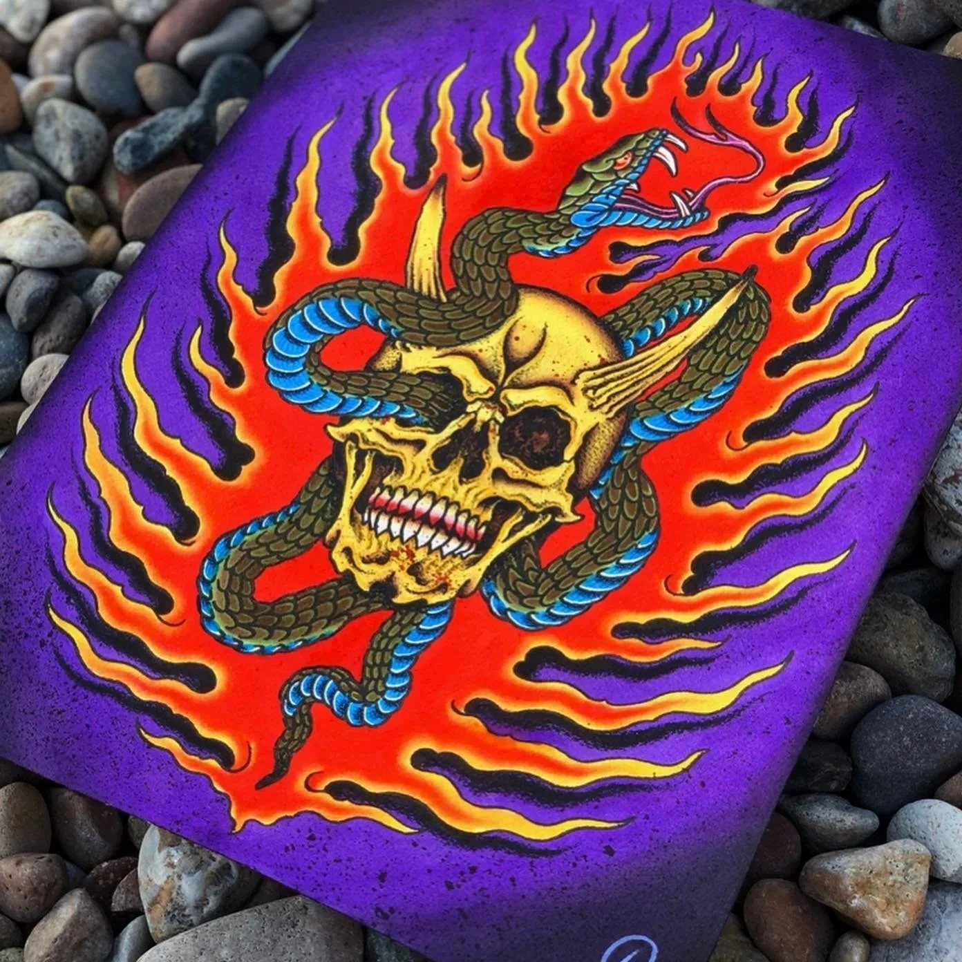 Bright purple canvas with a vivid tattoo-style skull, a snake, and flames.