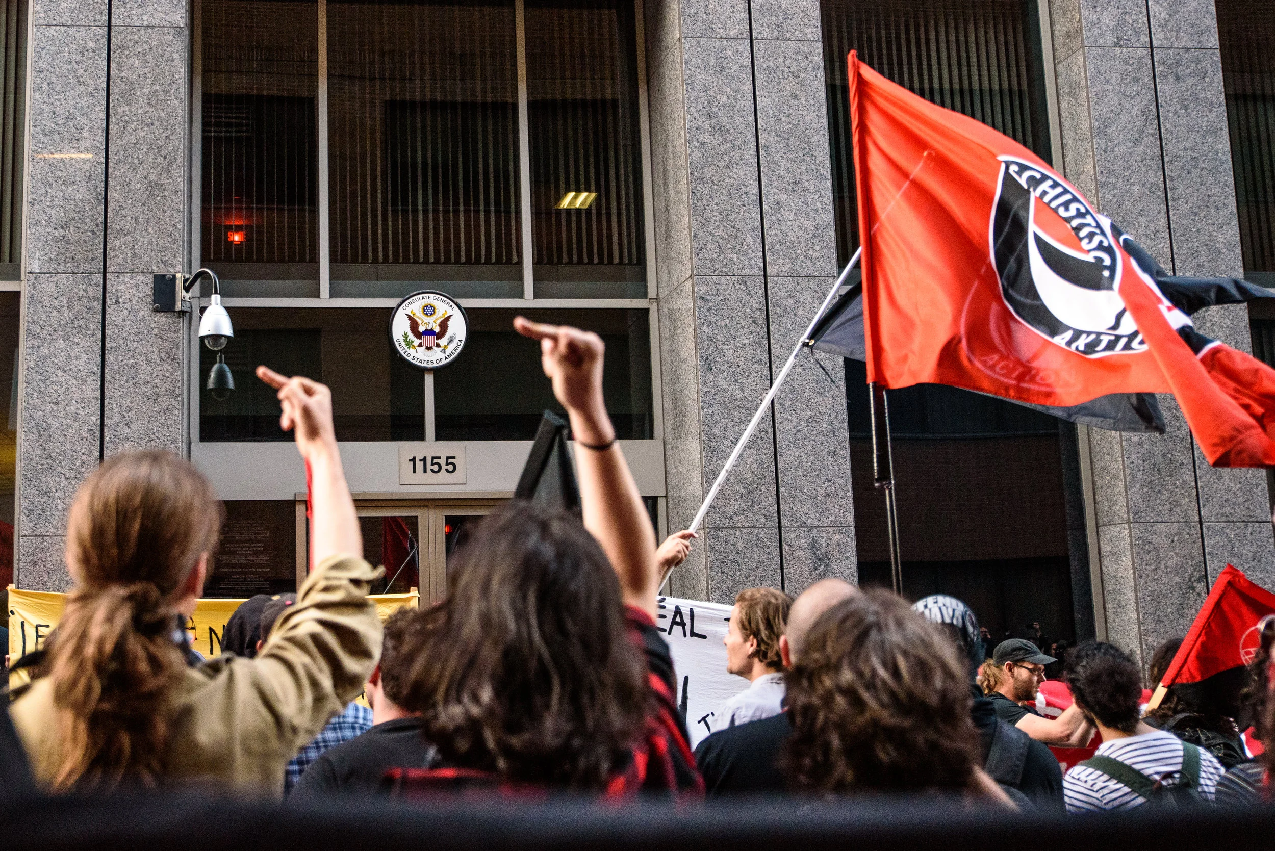 Antifascists protesters gather in front of the US consulate in downtown Montreal.