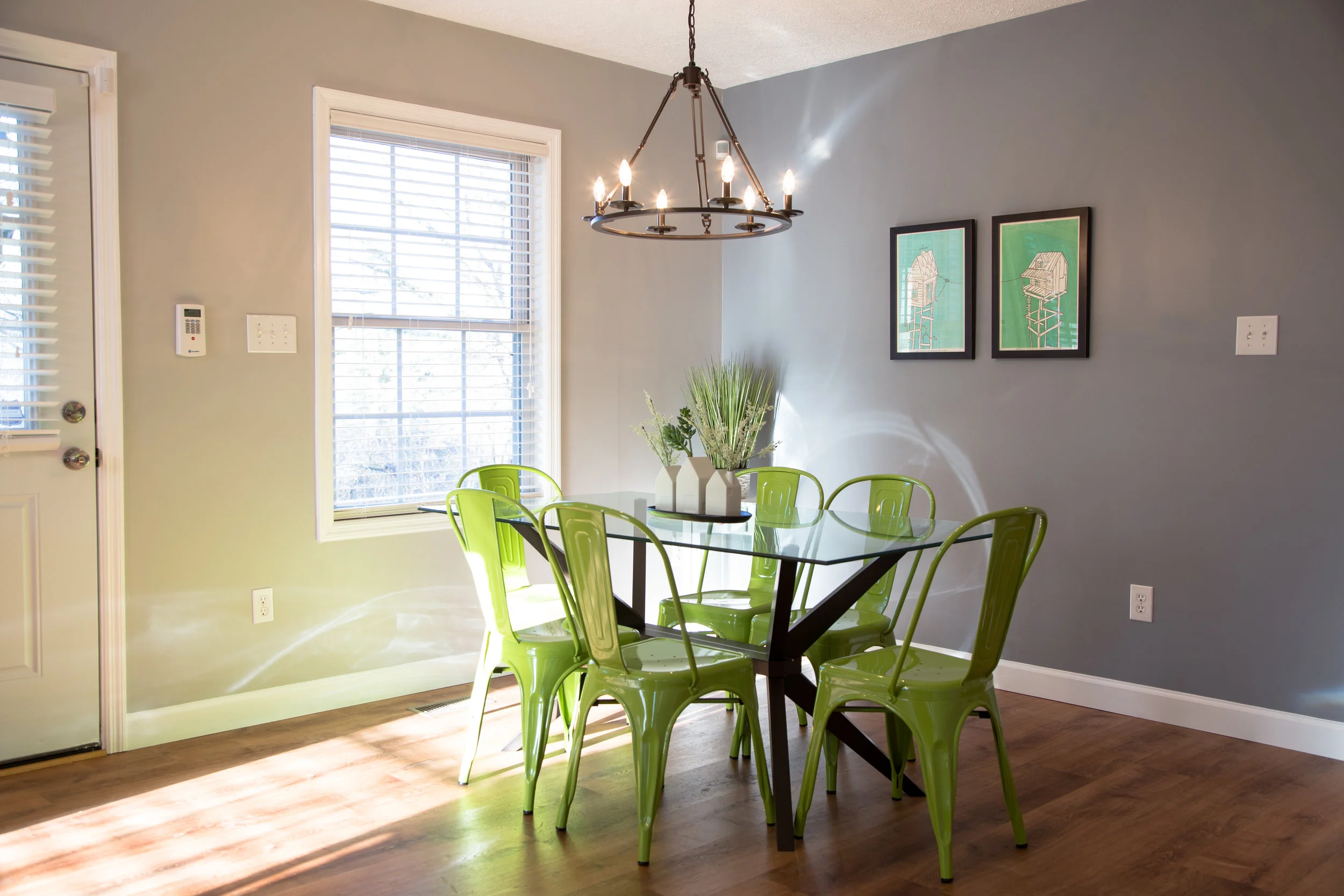 A bright, open floorplan connects the living, dining, and kitchen areas. 