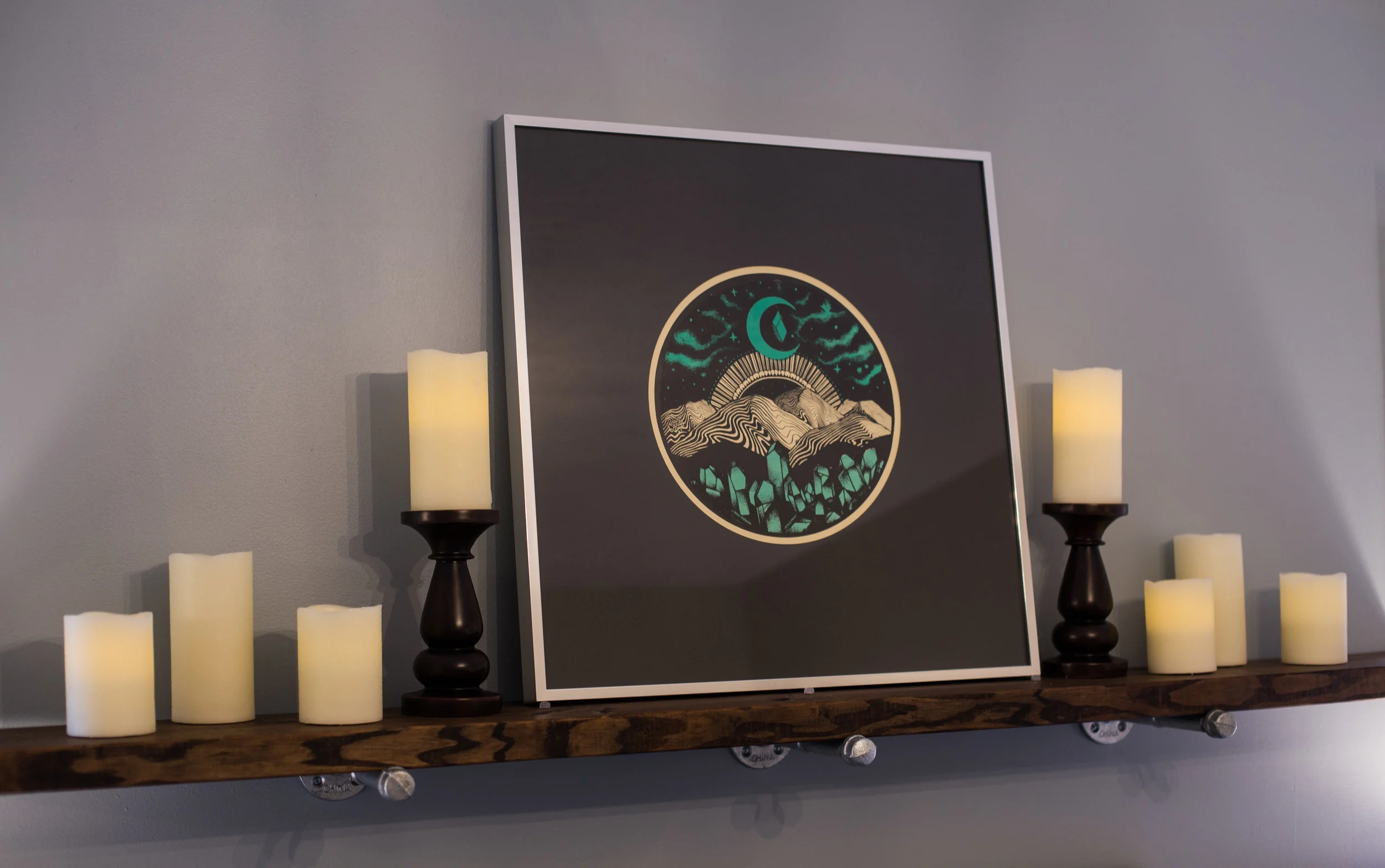 Local art helps create a peaceful ambiance in the master bedroom. 