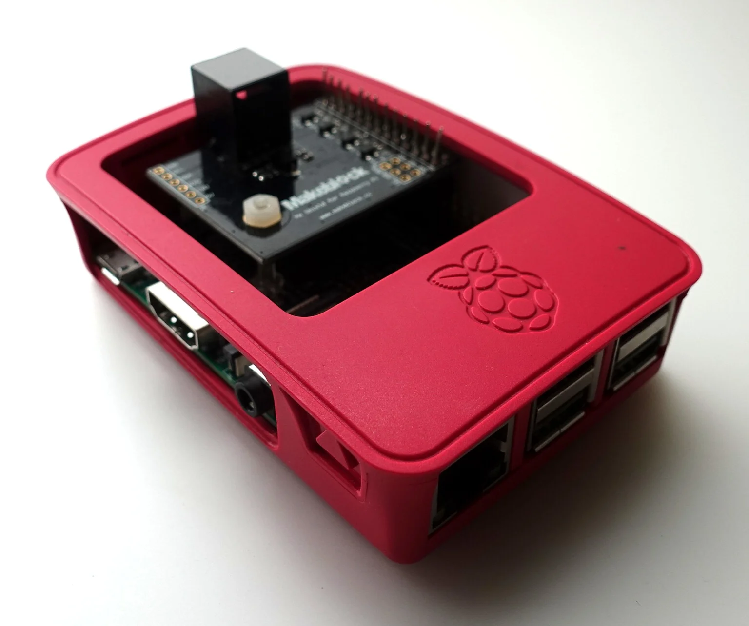 This is the Raspberry Pi. It should be stuck in place with Velcro and connected to the robot by two cables. More on that below.