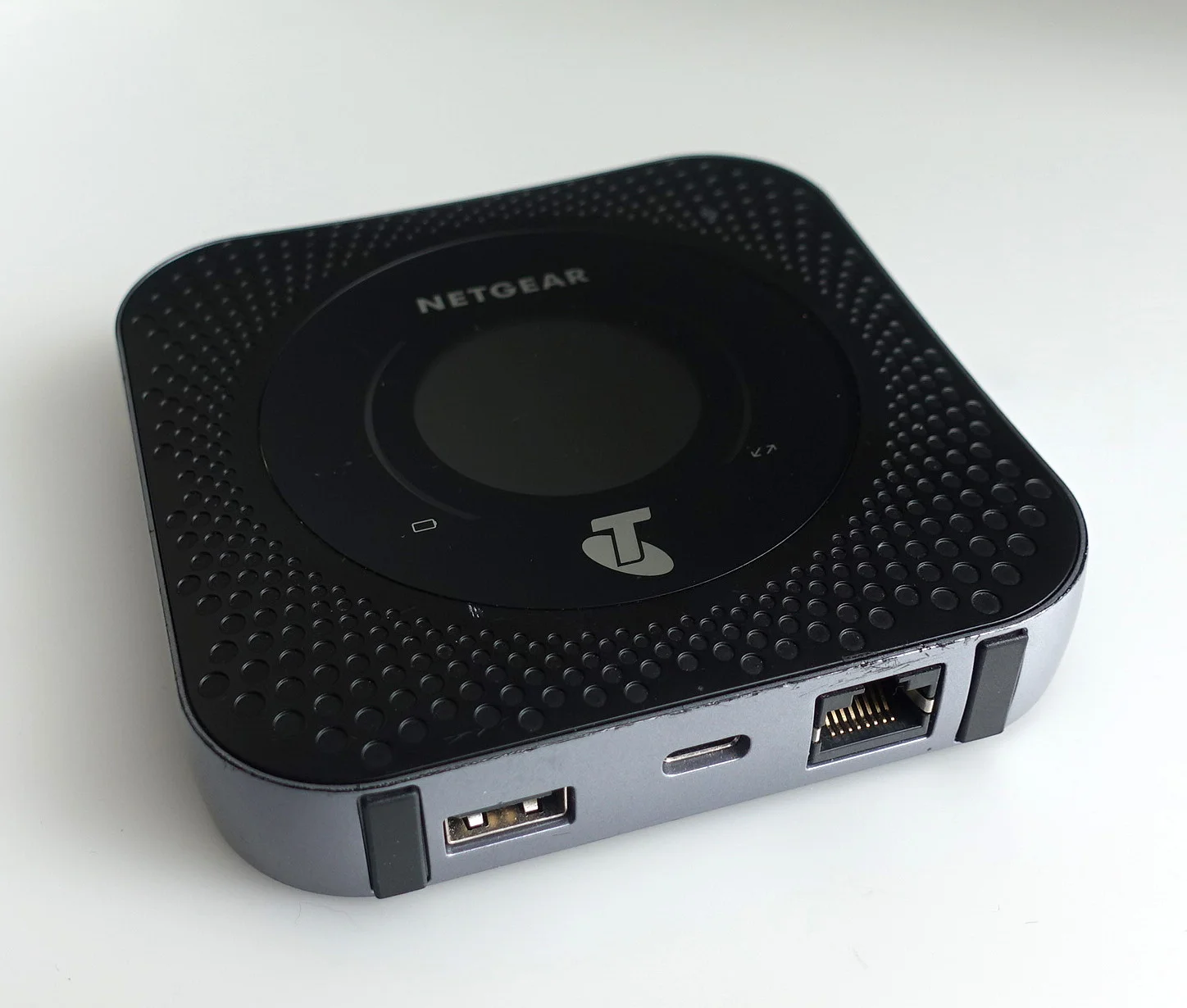 This is the router. It should be attached with Velcro to the upper part of the robot and be connected to the robot by at least one cable (Ethernet). I may also possibly plugged into power via USB C.