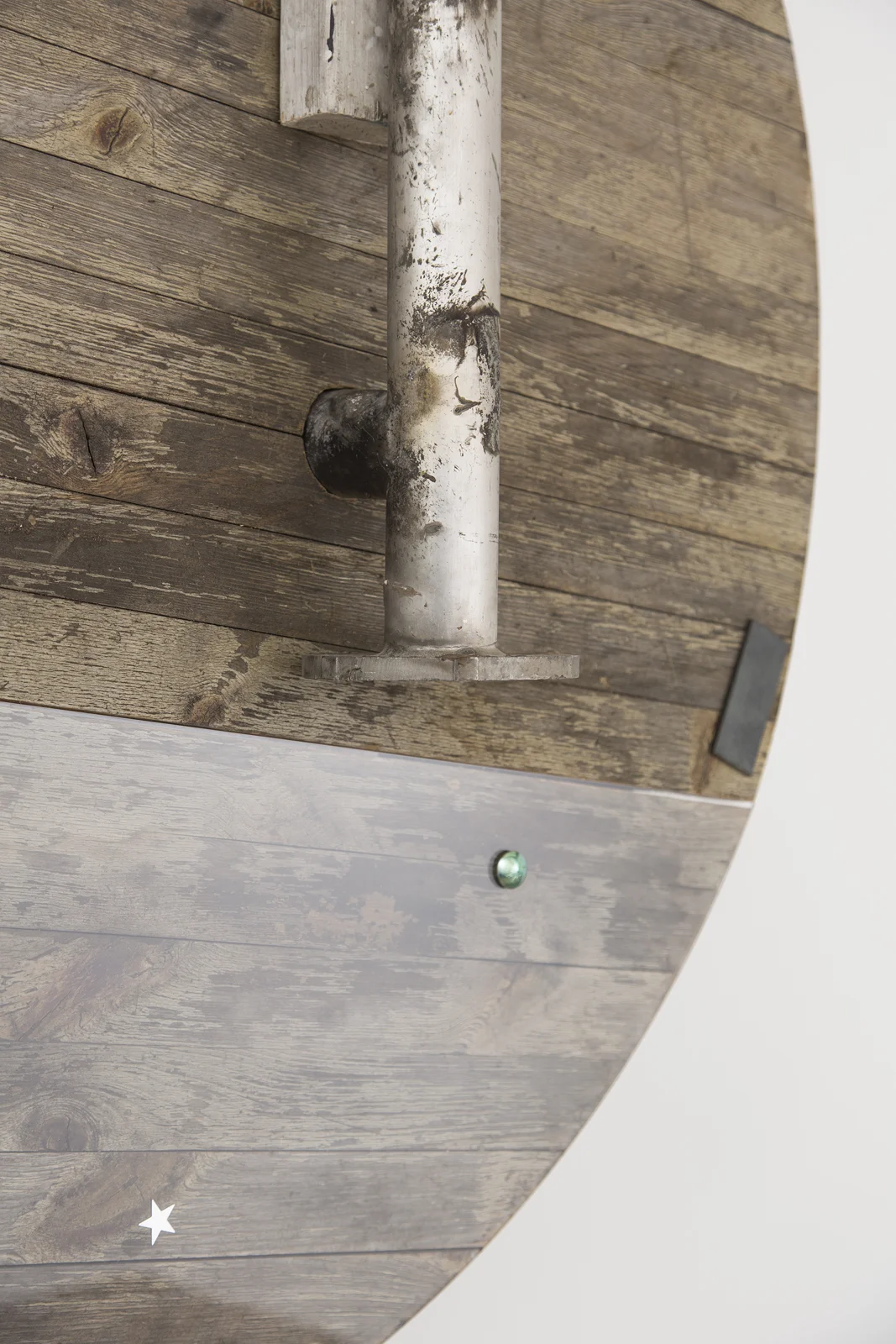 Detail of HUB99 , 2018 Wood table top, stainless steel, plexiglass, metallic star cutouts, wood, plaster, various hardware 43 x 46 inches (109 x 116.8 cm)