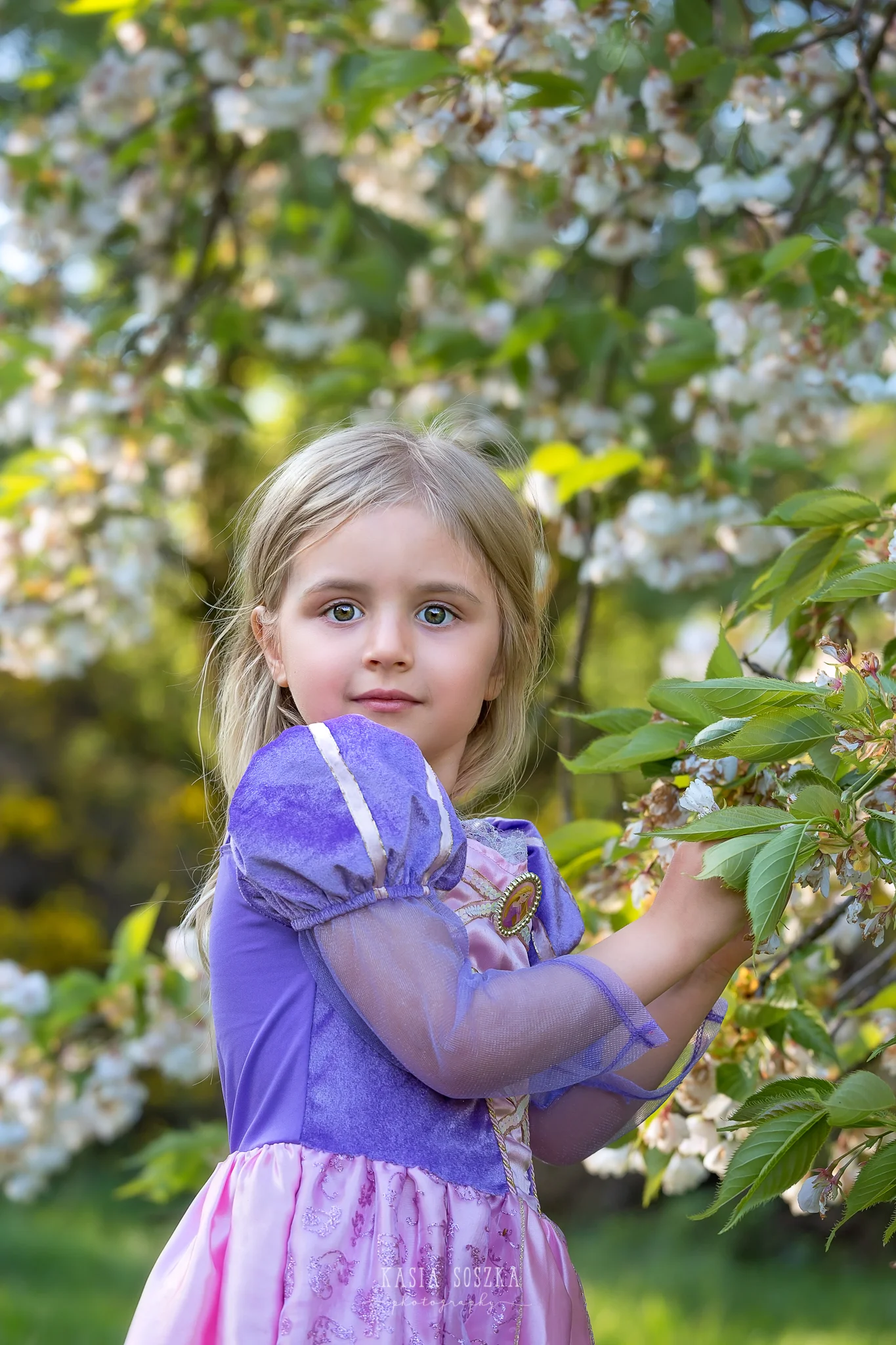 Leeds child photography Bradford child session York children photography: pretty little blond girl in a princess dress with apple blossoms