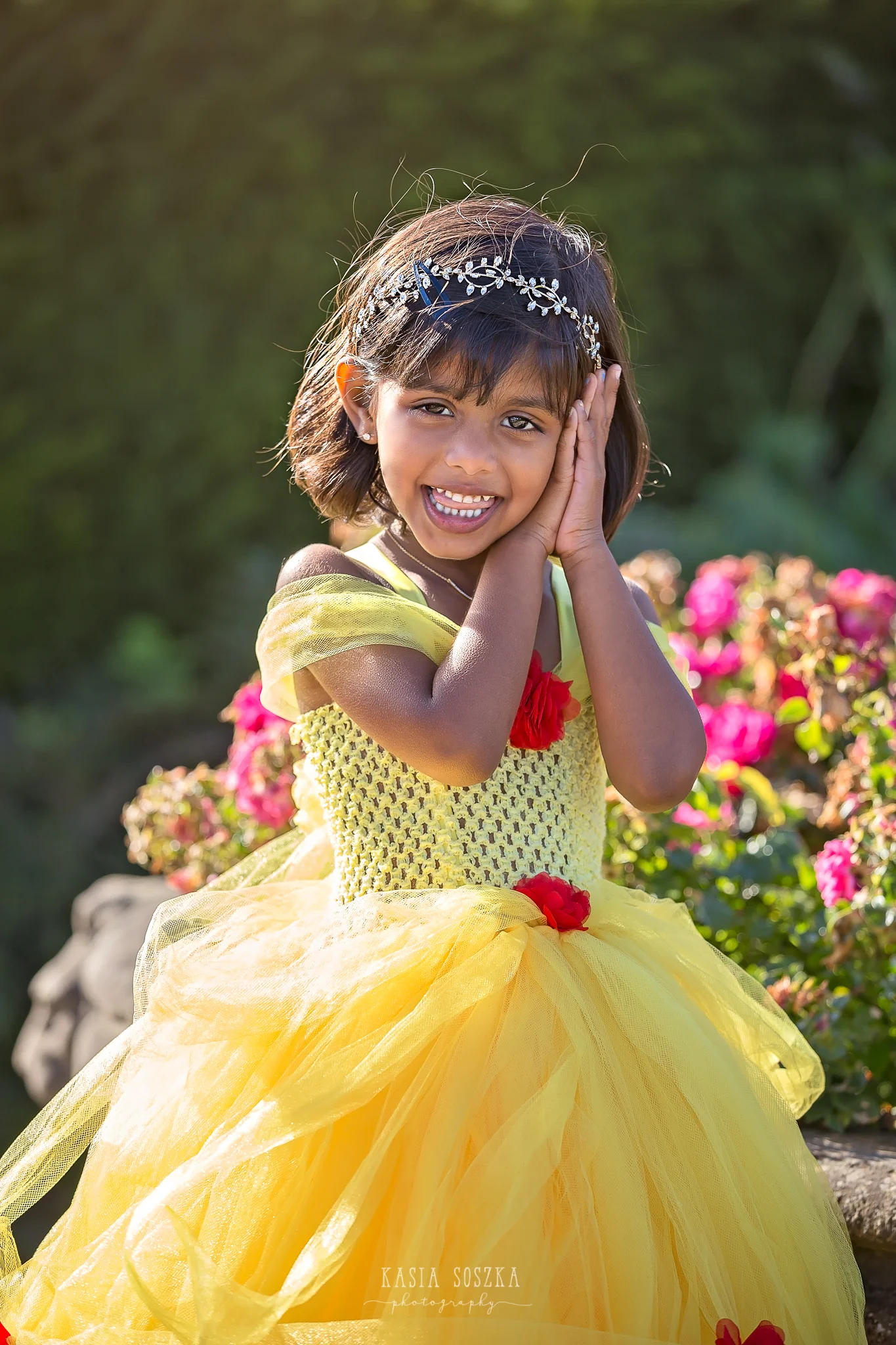 Child photography Leeds, child outdoor princess session Leeds, Yorkshire: beautiful little girl in a yellow princess dress running in a garden