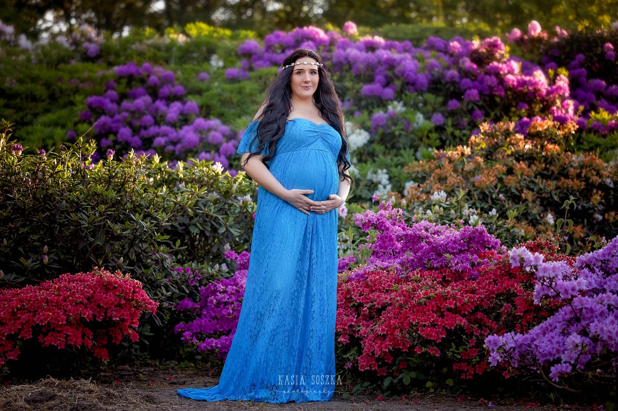 Maternity photography Leeds, Yorkshire, pregnancy session Leeds: beautiful pregnant woman with long black hair posing for a maternity photos in a spring garden
