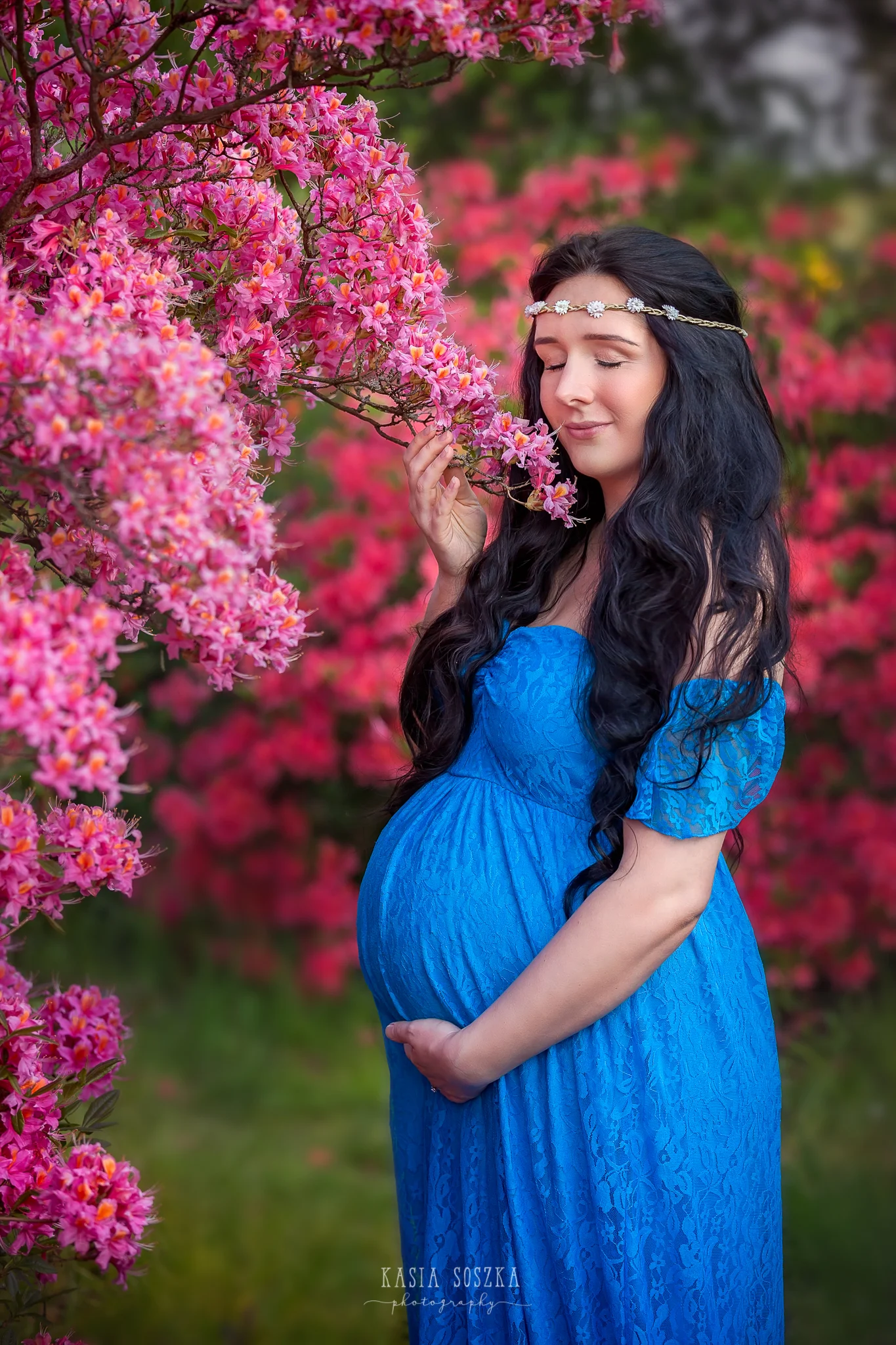 Maternity photography Leeds, Yorkshire, pregnancy session Leeds: beautiful pregnant woman with long black hair smelling spring blossoms