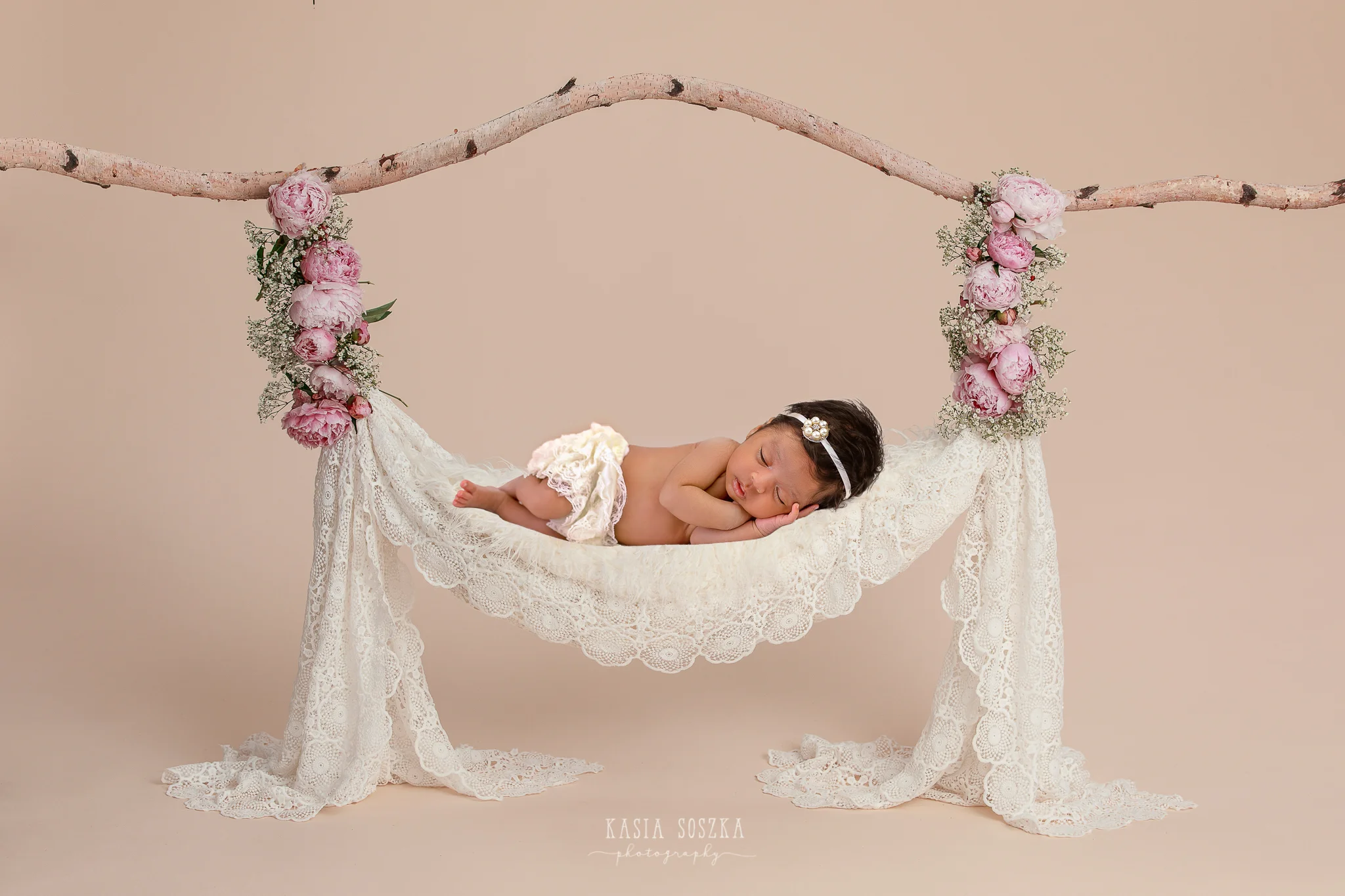 Newborn photography Leeds, Yorkshire, newborn session Leeds, York, Harrogate, Bradford: cute newborn baby girl sleeping on a hammock