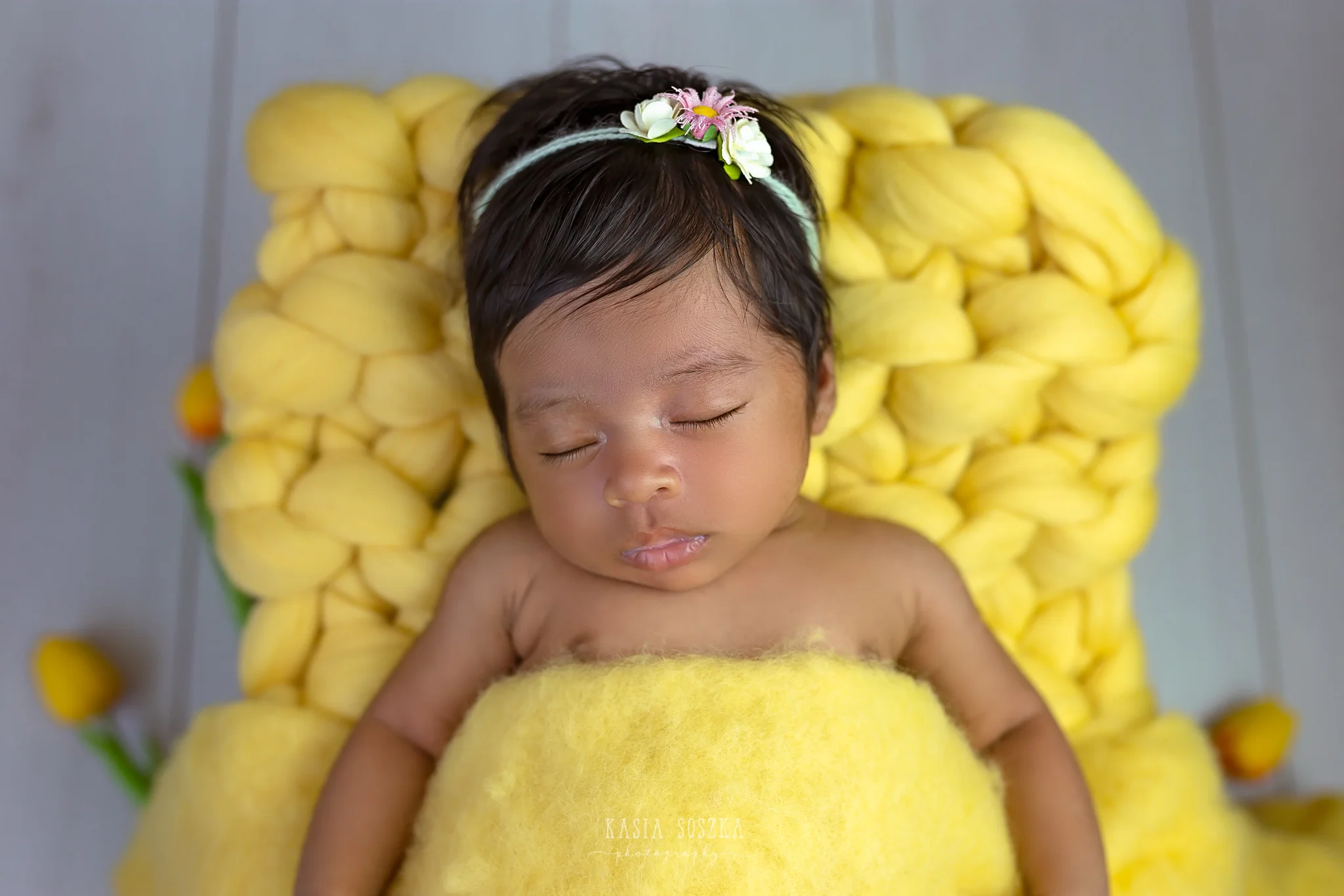 Newborn photography Leeds, Yorkshire, newborn session Leeds, York, Harrogate, Bradford: newborn baby girl sleeping on a yellow blanket