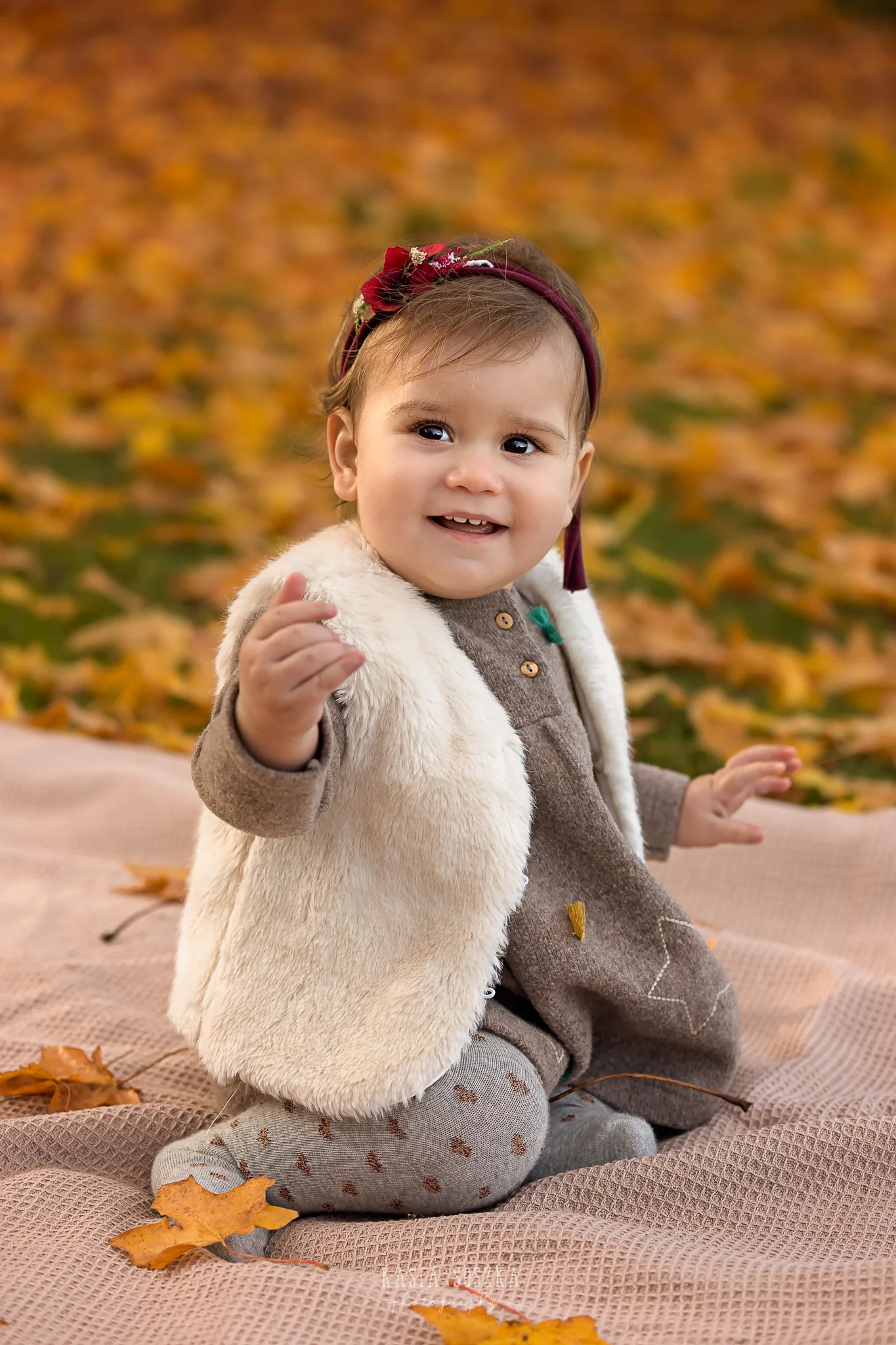 Baby milestone photography Leeds, York, Bradford, Harrogate: cute baby girl’s first birthday portrait session. Autumn outdoor baby photo shoot in Leeds, Yorkshire