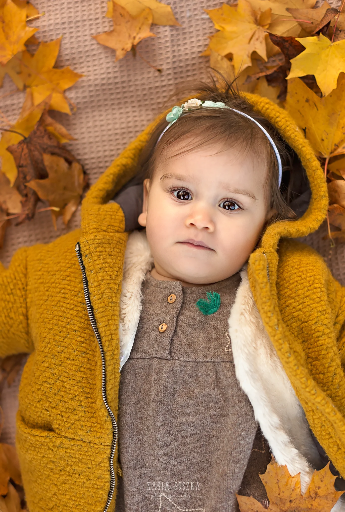 Baby milestone photography Leeds, York, Bradford, Harrogate: cute baby girl’s first birthday portrait session. Autumn outdoor baby photo shoot in Leeds, Yorkshire
