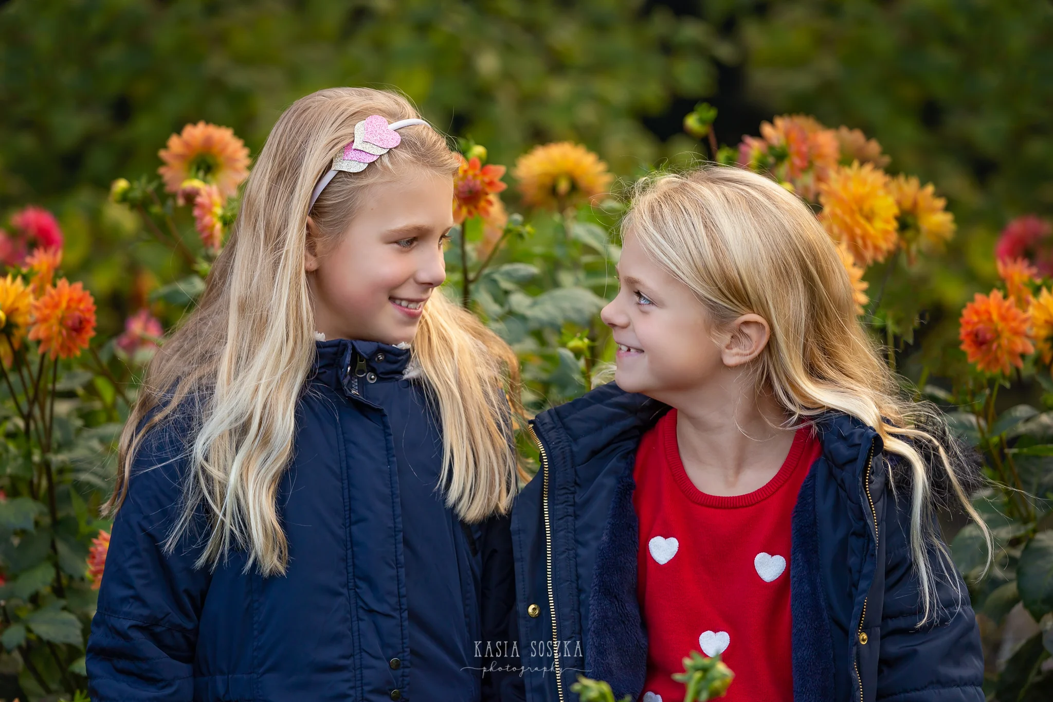 Children photography, child photographer Leeds, York, Bradford, Harrogate: pretty blond sisters and autumn flower display