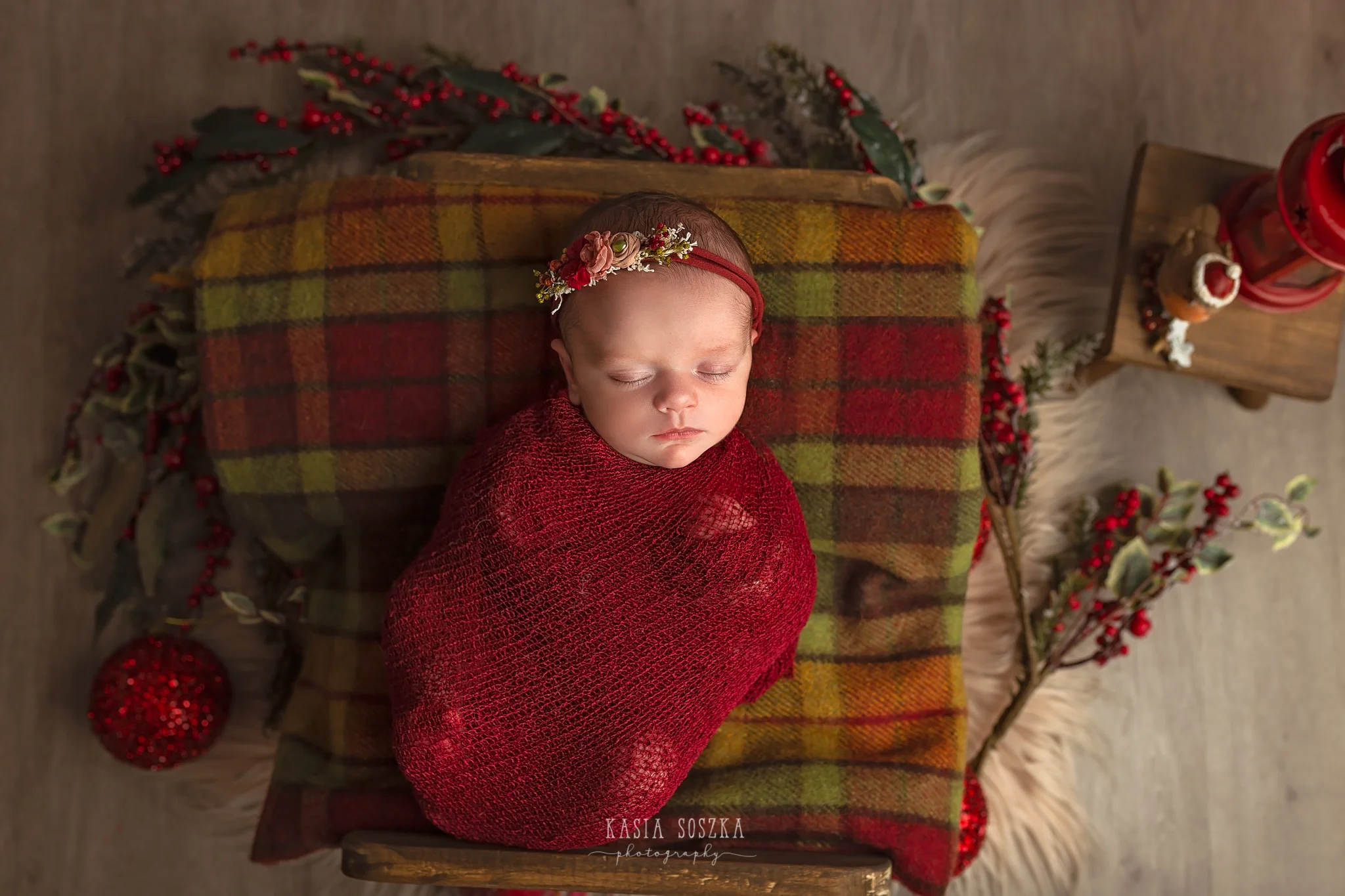 Newborn photography in Leeds near Bradford, York and Harrogate: cute newborn baby girl in Christmas set up