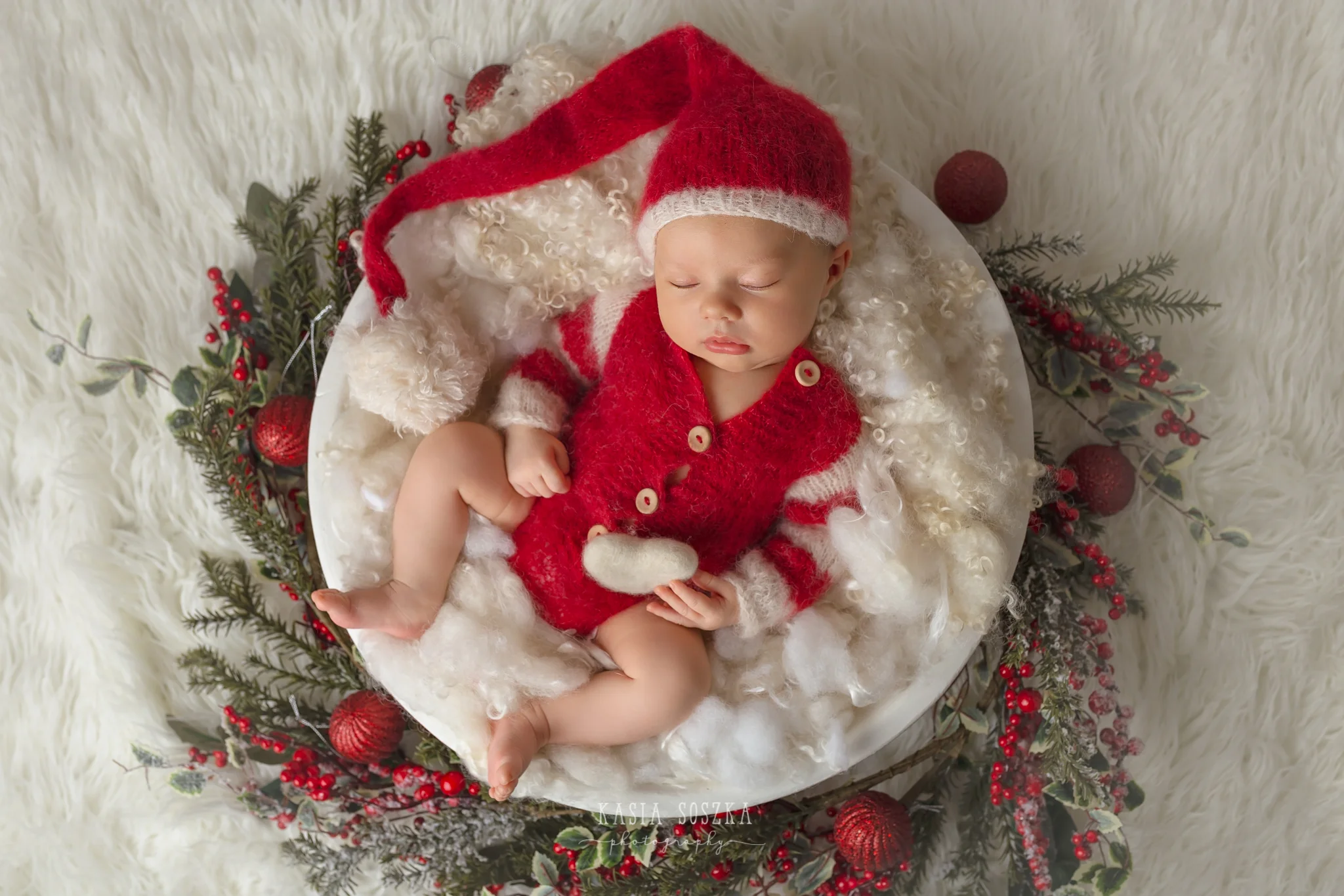 Newborn photography Leeds-York-Bradford-Harrogate: Christmas newborn session in Leeds, Yorkshire. Cute newborn baby girl in Santa Claus outfit