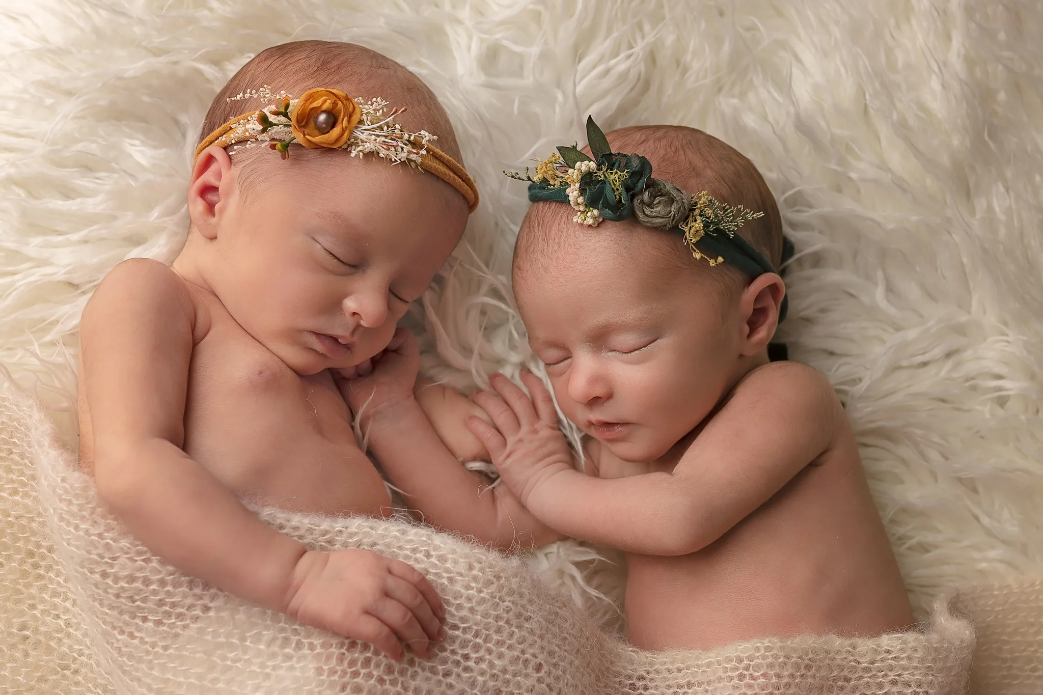 Newborn twin photographer Leeds, newborn photographer Leeds-York-Harrogate-Bradford, Yorkshire: winter theme twin session in Leeds, Yorkshire. Twin baby girls sleeping on a white blanket