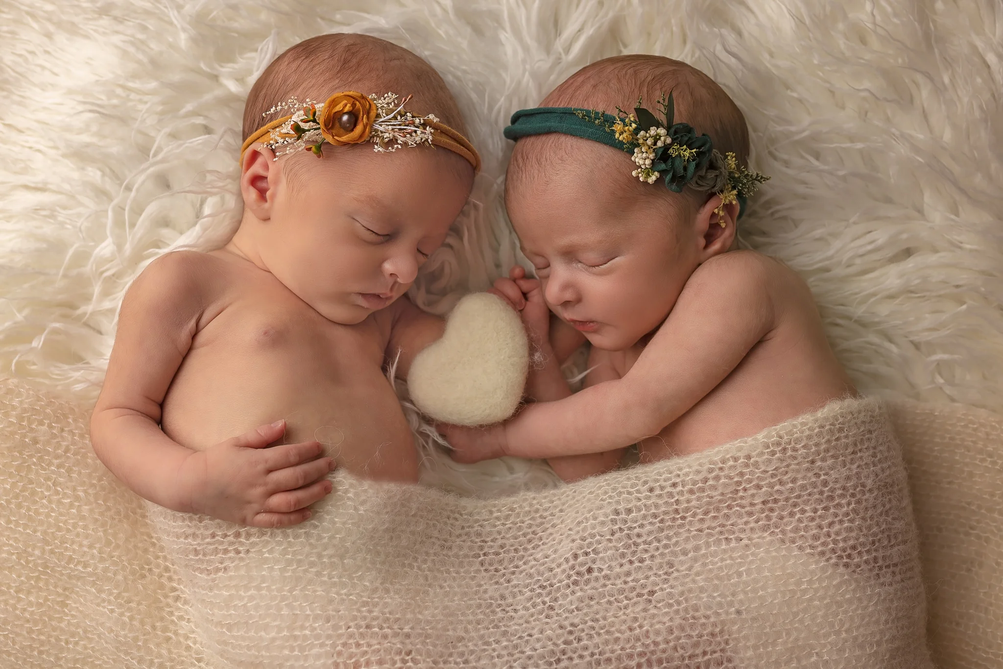 Newborn twin photographer Leeds, newborn photographer Leeds-York-Harrogate-Bradford, Yorkshire: winter theme twin session in Leeds, Yorkshire. Twin baby girls sleeping on a white blanket