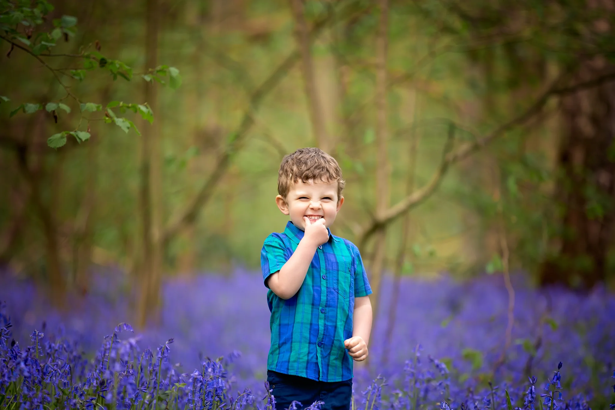 Child photographer Leeds, York, Harrogare, Bradford: cute little boy during bluebell session in Leeds, West Yorkshire