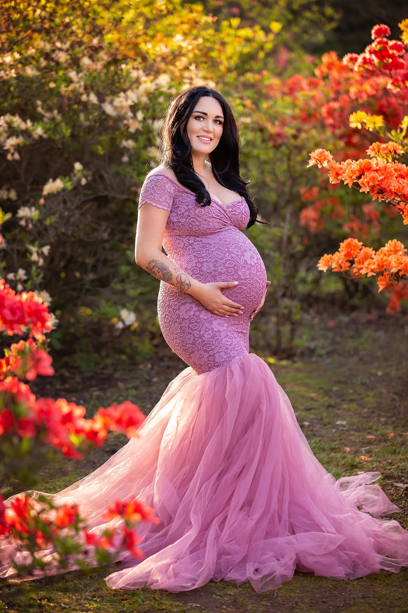 Maternity photography Leeds, York, Harrogate, Wakefield, Bradford: stunning mum-to-be in a long dusky pink gown posing for a pregnancy photo in Leeds, West Yorkshire