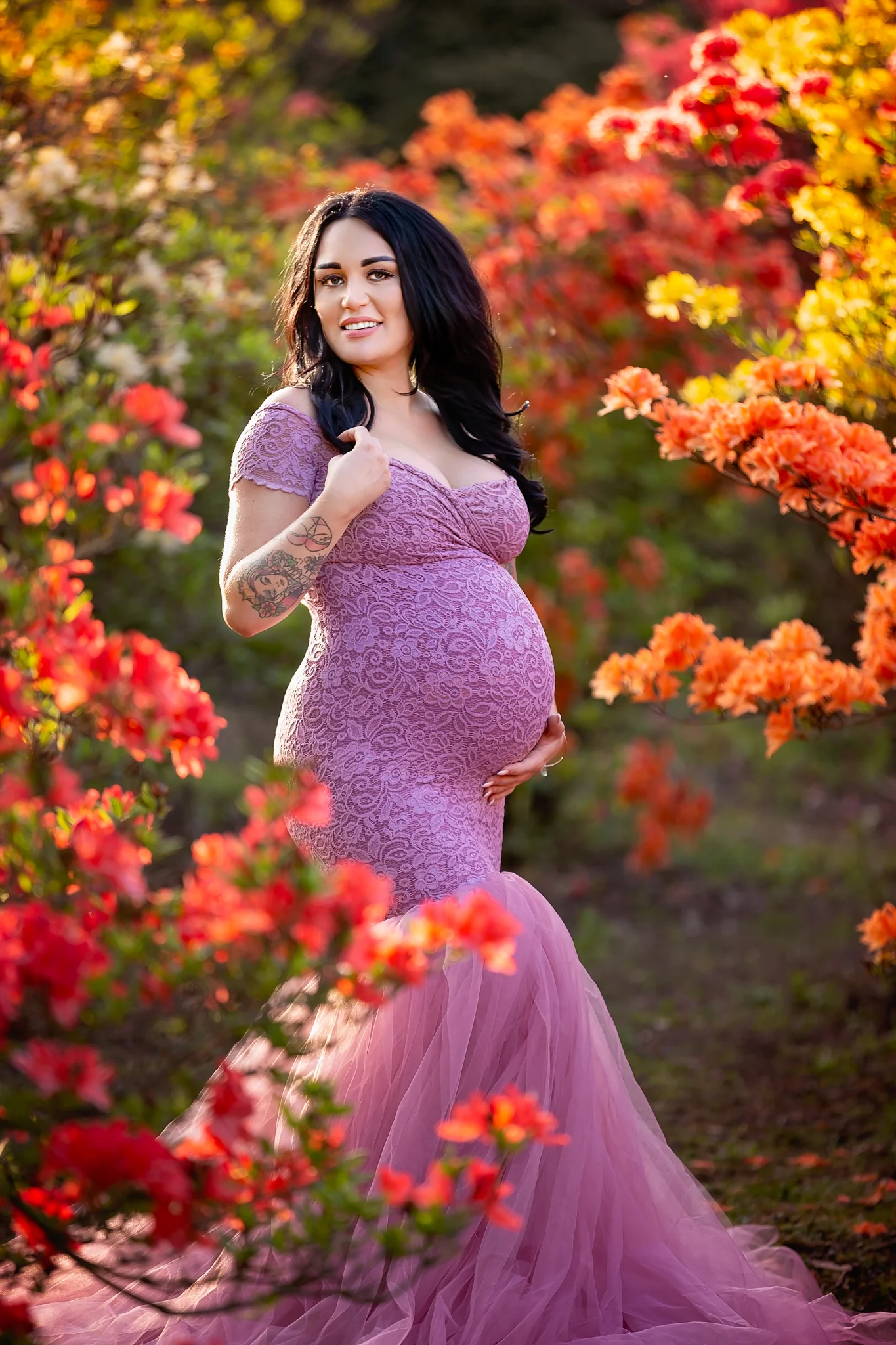 Maternity photography Leeds, York, Harrogate, Wakefield, Bradford: stunning mum-to-be in a long dusky pink gown posing for a pregnancy photo in Leeds, West Yorkshire