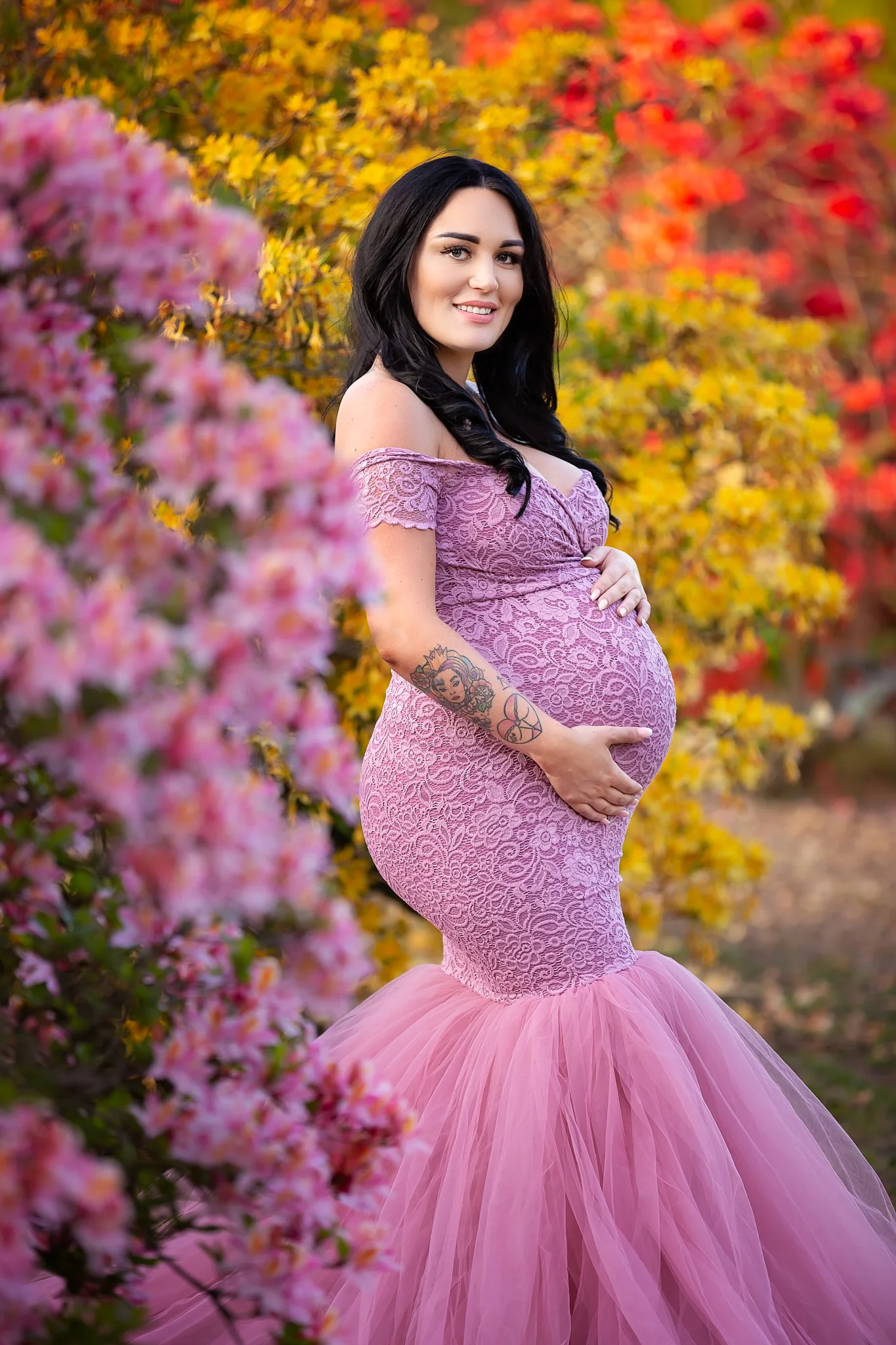 Maternity photography Leeds, York, Harrogate, Wakefield, Bradford: stunning mum-to-be in a long dusky pink gown posing for a pregnancy photo in Leeds, West Yorkshire