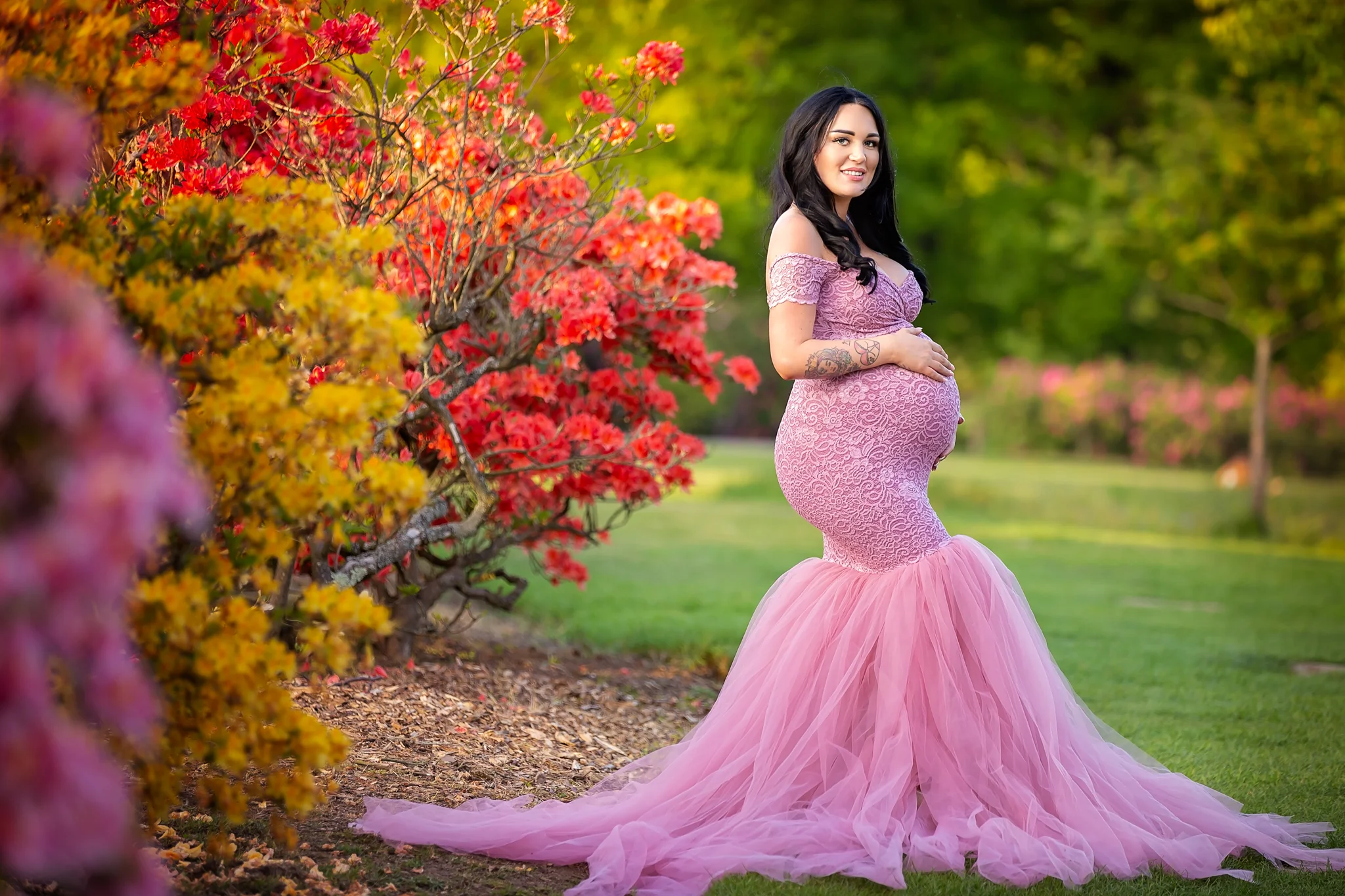 Maternity photography Leeds, York, Harrogate, Wakefield, Bradford: stunning mum-to-be in a long dusky pink gown posing for a pregnancy photo in Leeds, West Yorkshire