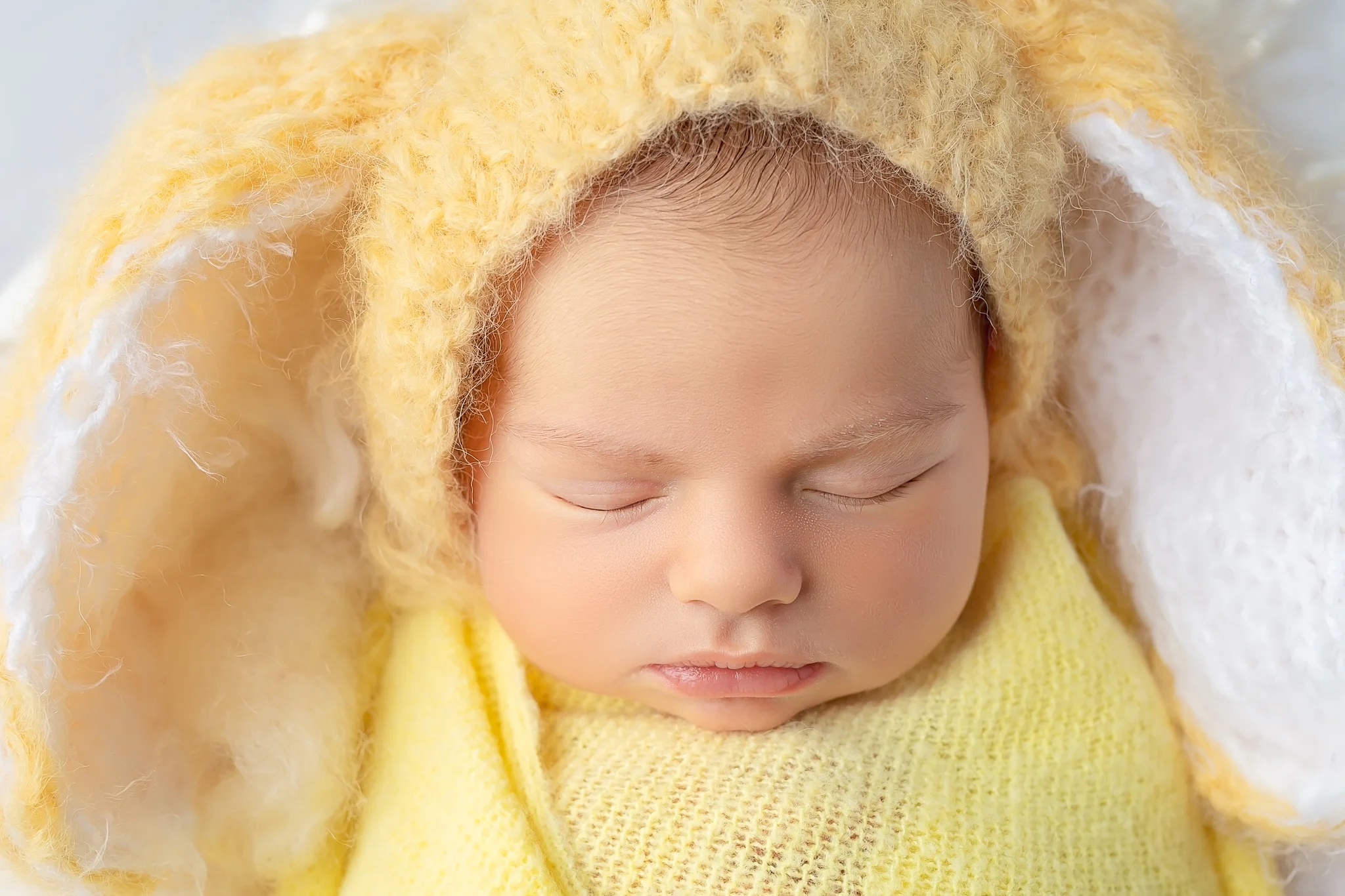 Newborn photography Leeds-York-Harrogate-Wakefield-Bradford: newborn baby girl in yellow bunny outfit