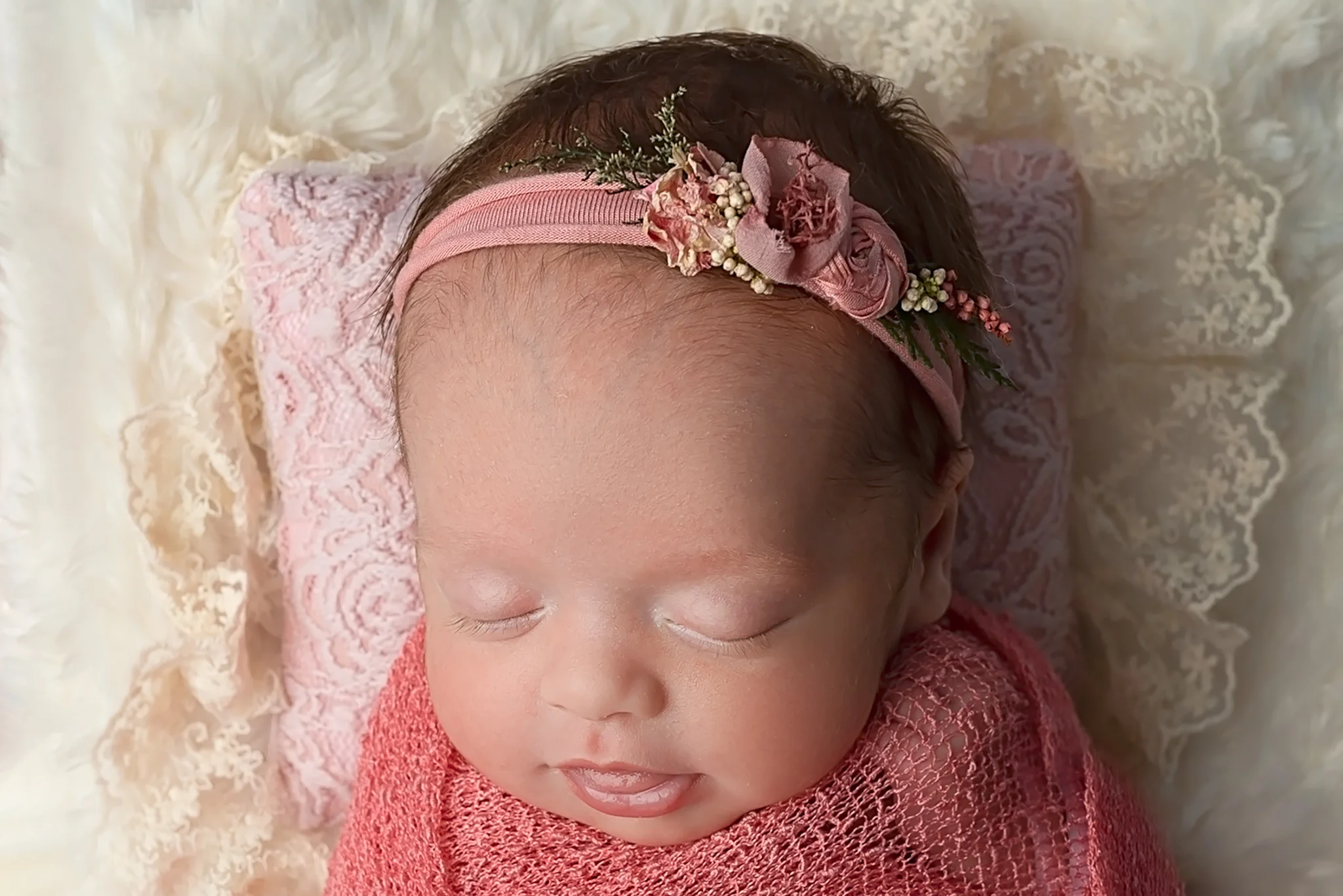 Professional newborn photography Leeds-York-Bradford-Harrogate-Wakefield: newborn baby girl sleeping in a bed during her newborn photoshoot in Leeds, Yorkshire
