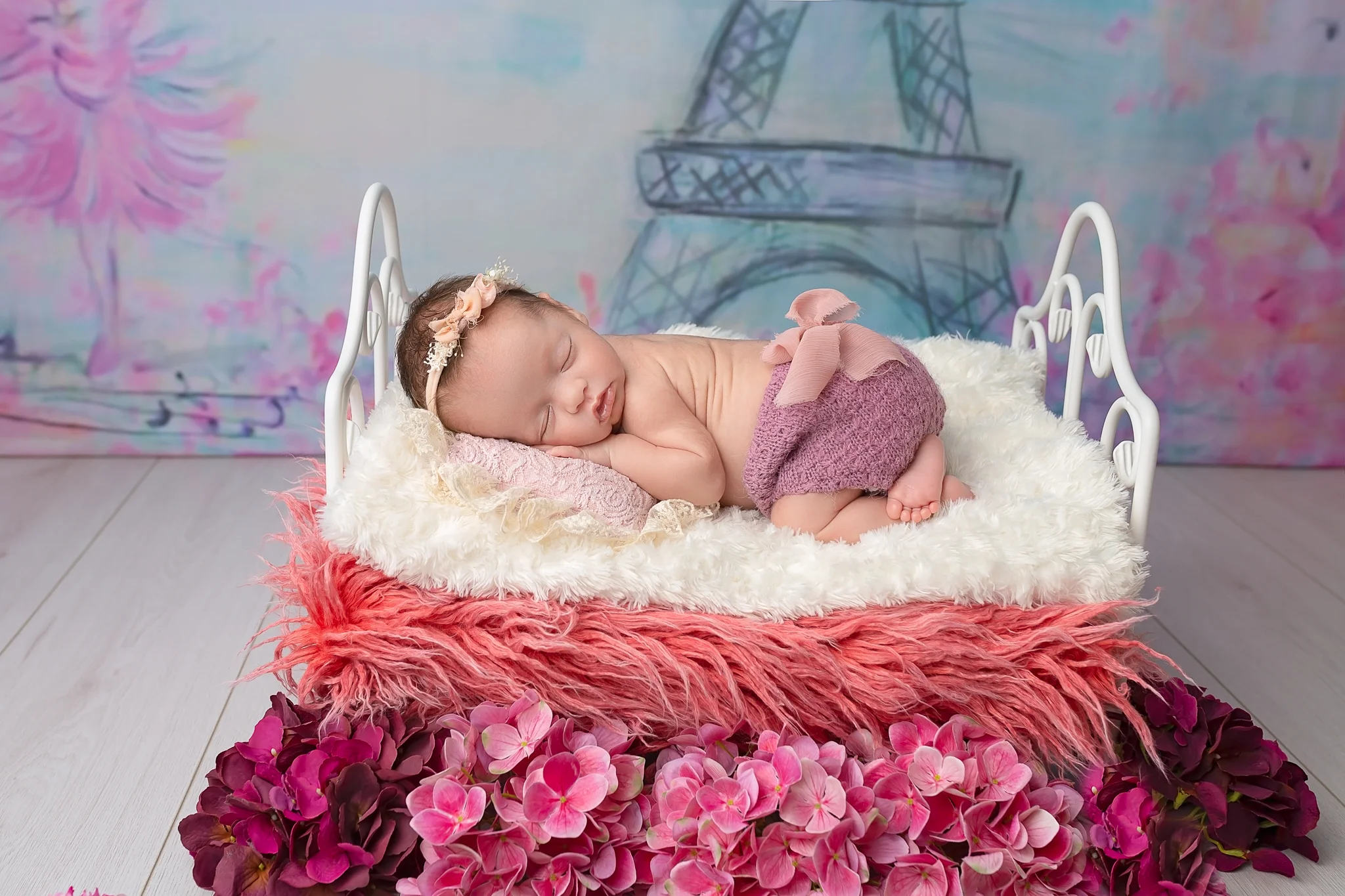 Professional newborn photography Leeds-York-Bradford-Harrogate-Wakefield: newborn baby girl sleeping in a cute little bed during her newborn photoshoot in Leeds, Yorkshire
