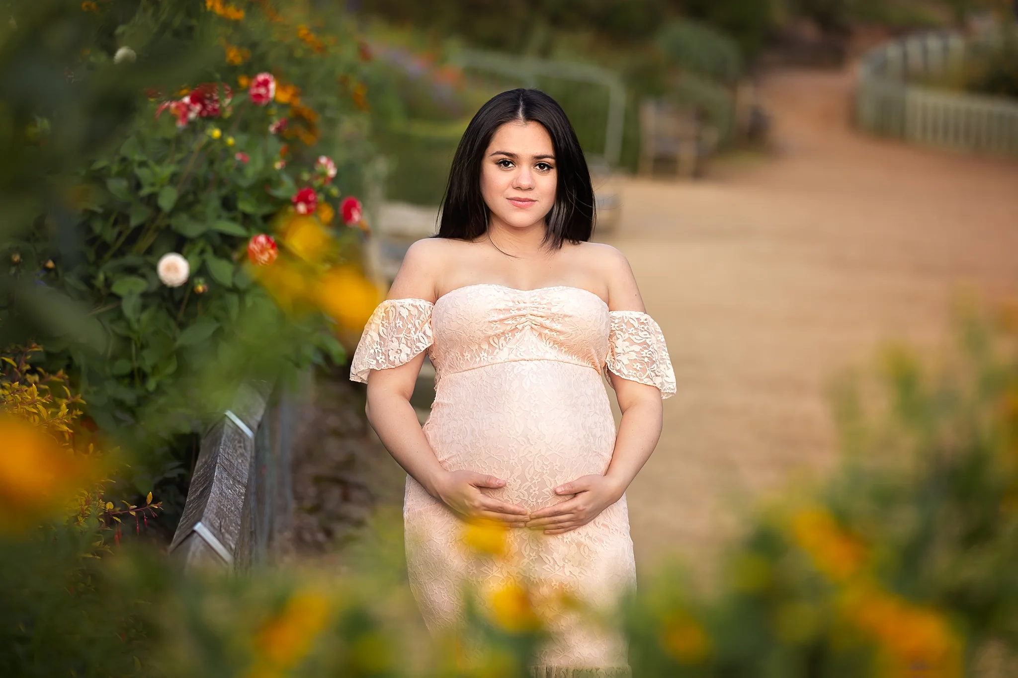 Summer maternity photography Leeds, Bradford, York, Harrogate, Wakefield: beautiful expecting woman in a lace gown posing for her maternity portrait in Leeds, West Yorkshire.