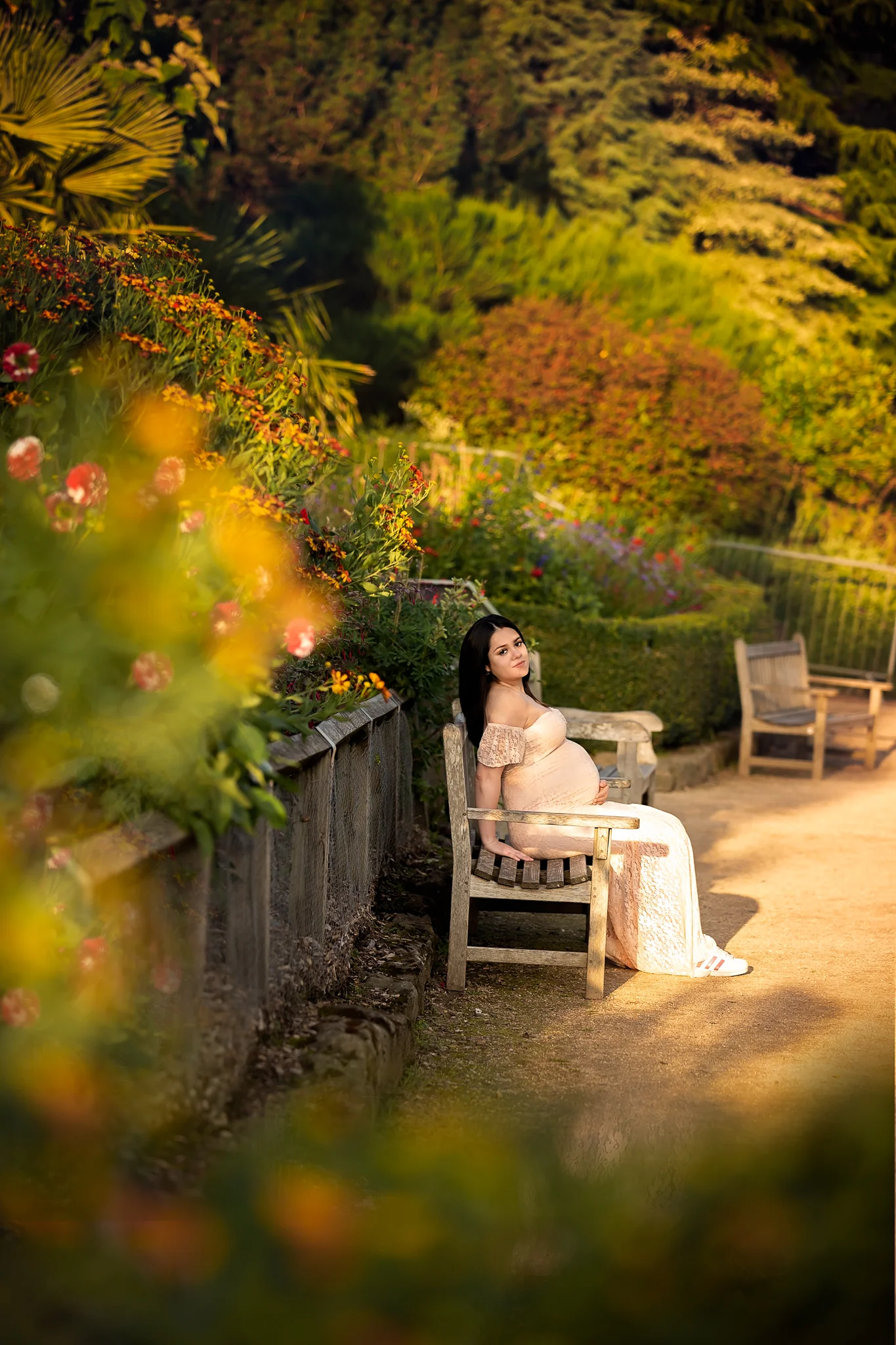 Summer maternity photography Leeds, Bradford, York, Harrogate, Wakefield: beautiful expecting woman posing for her maternity portrait in a summer garden in Leeds, West Yorkshire.