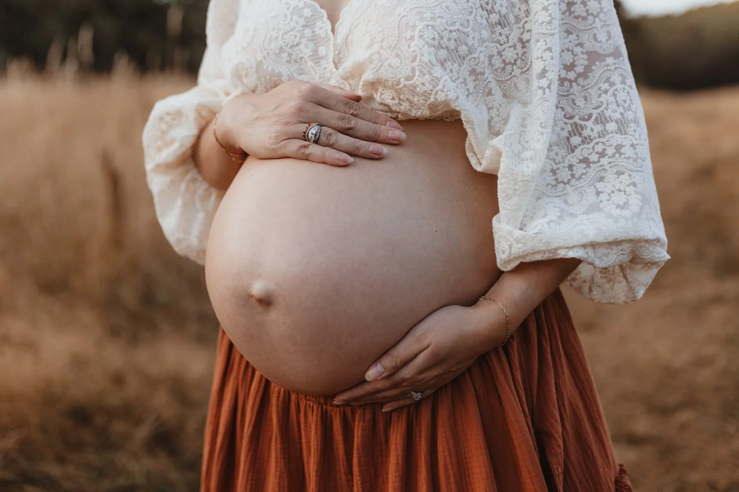 A close up portrait of a pregnant belly