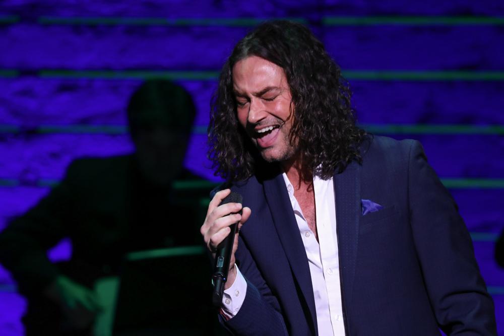 Constantine Maroulis singing on stage at Only Make Believe Gala