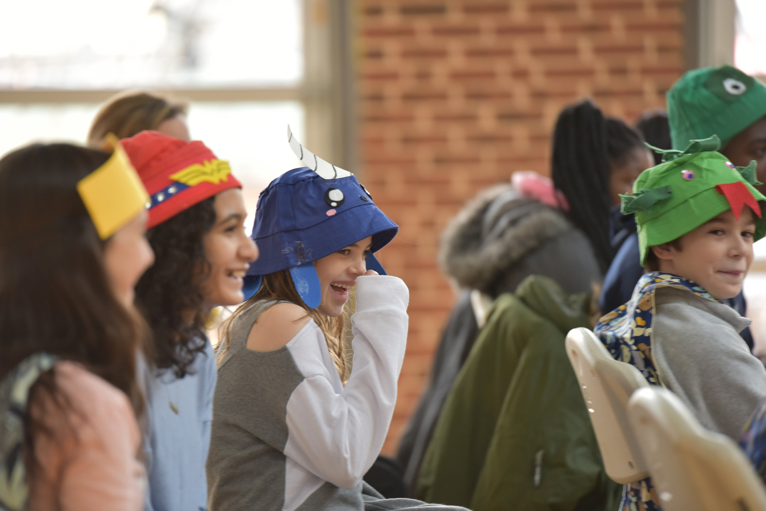 Children laughing during children's theatre performance