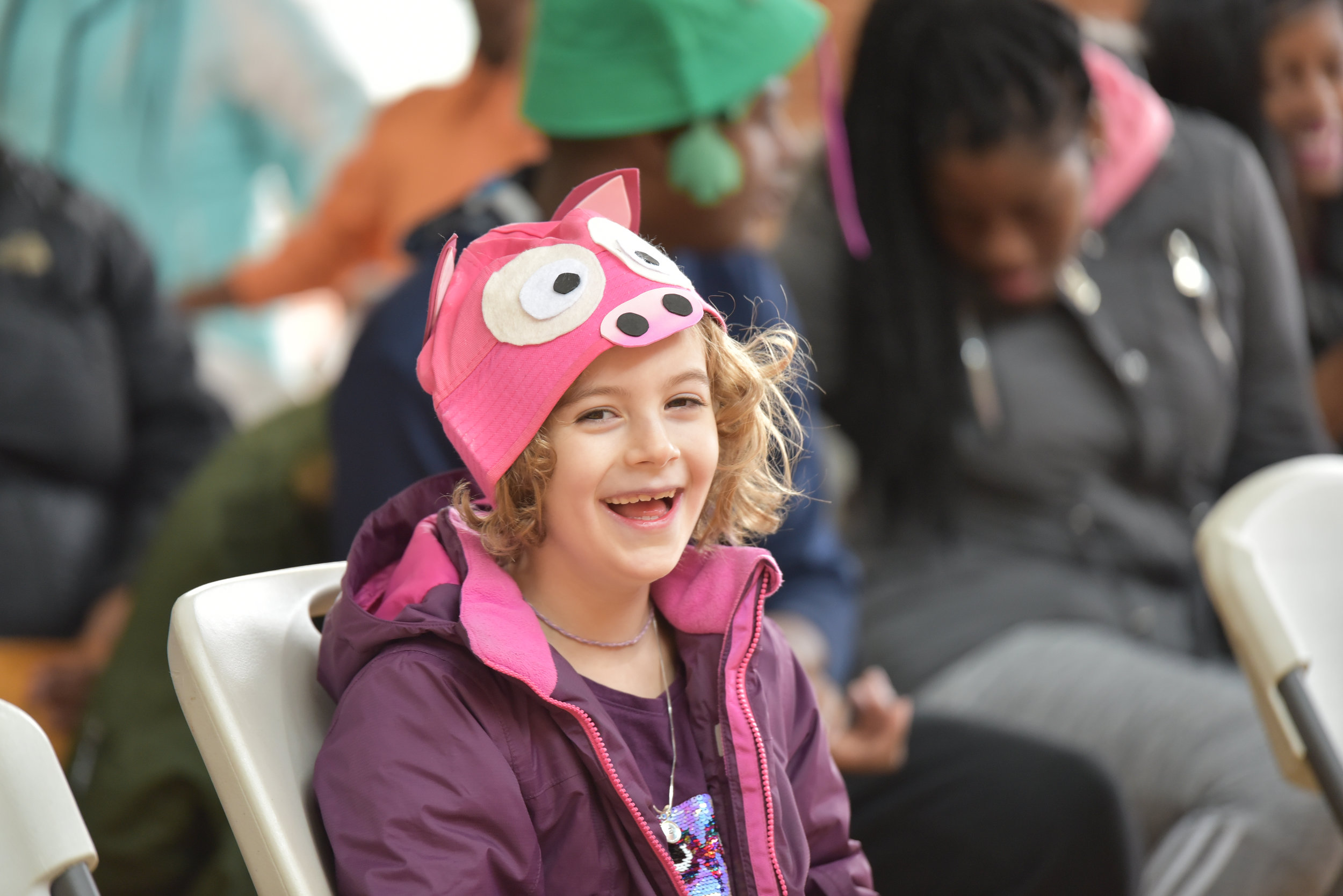 Child smiling during children's theatre performance