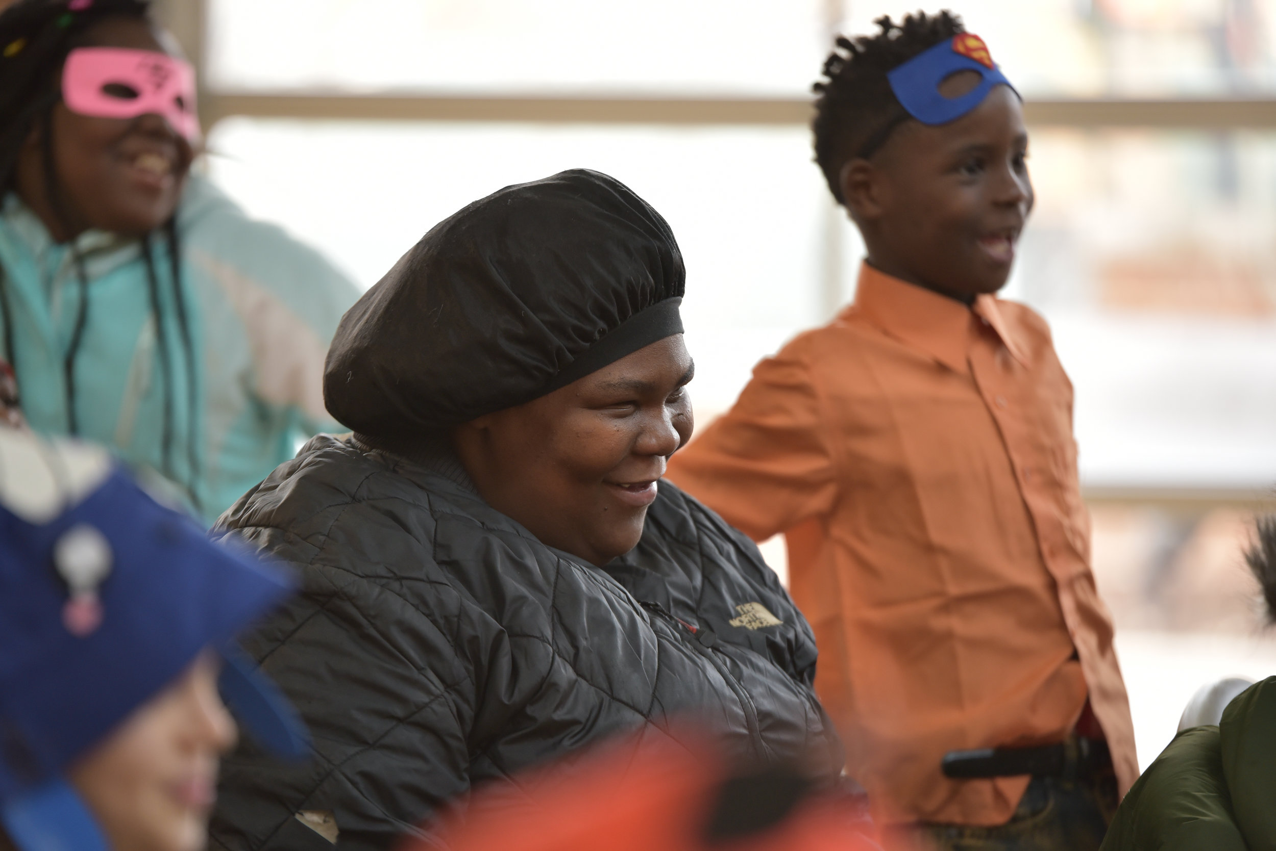 Child smiling during children's theatre performance