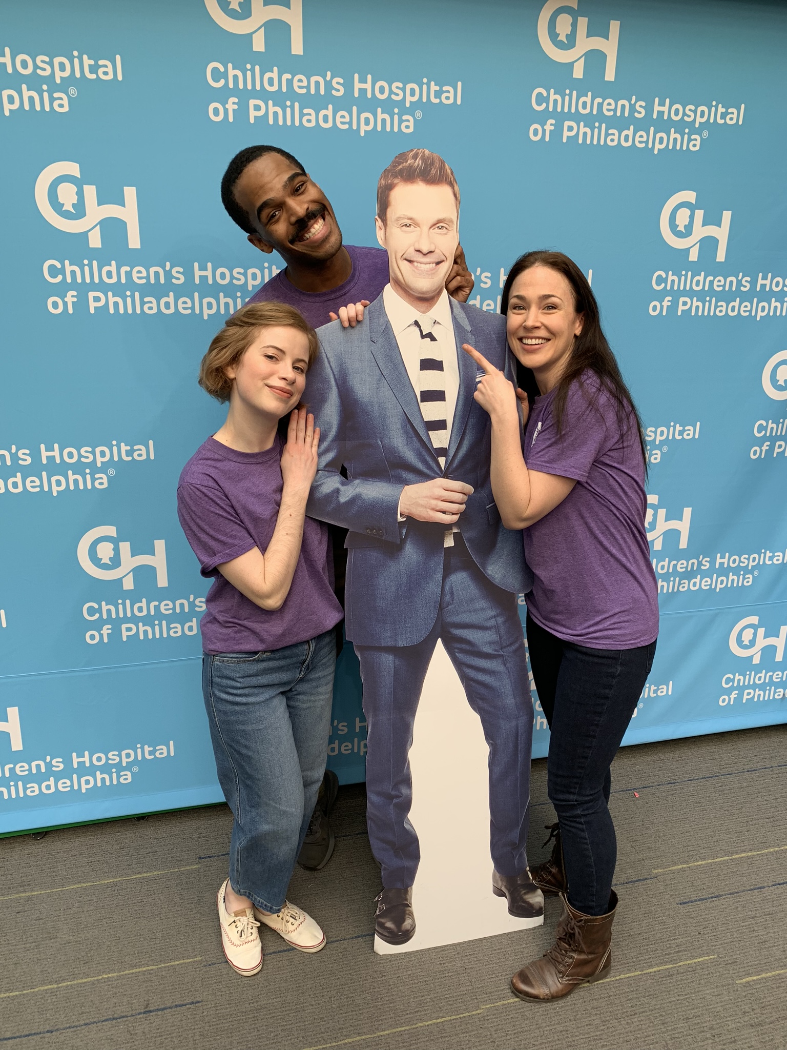 Actors posing with Ryan Seacrest cutout