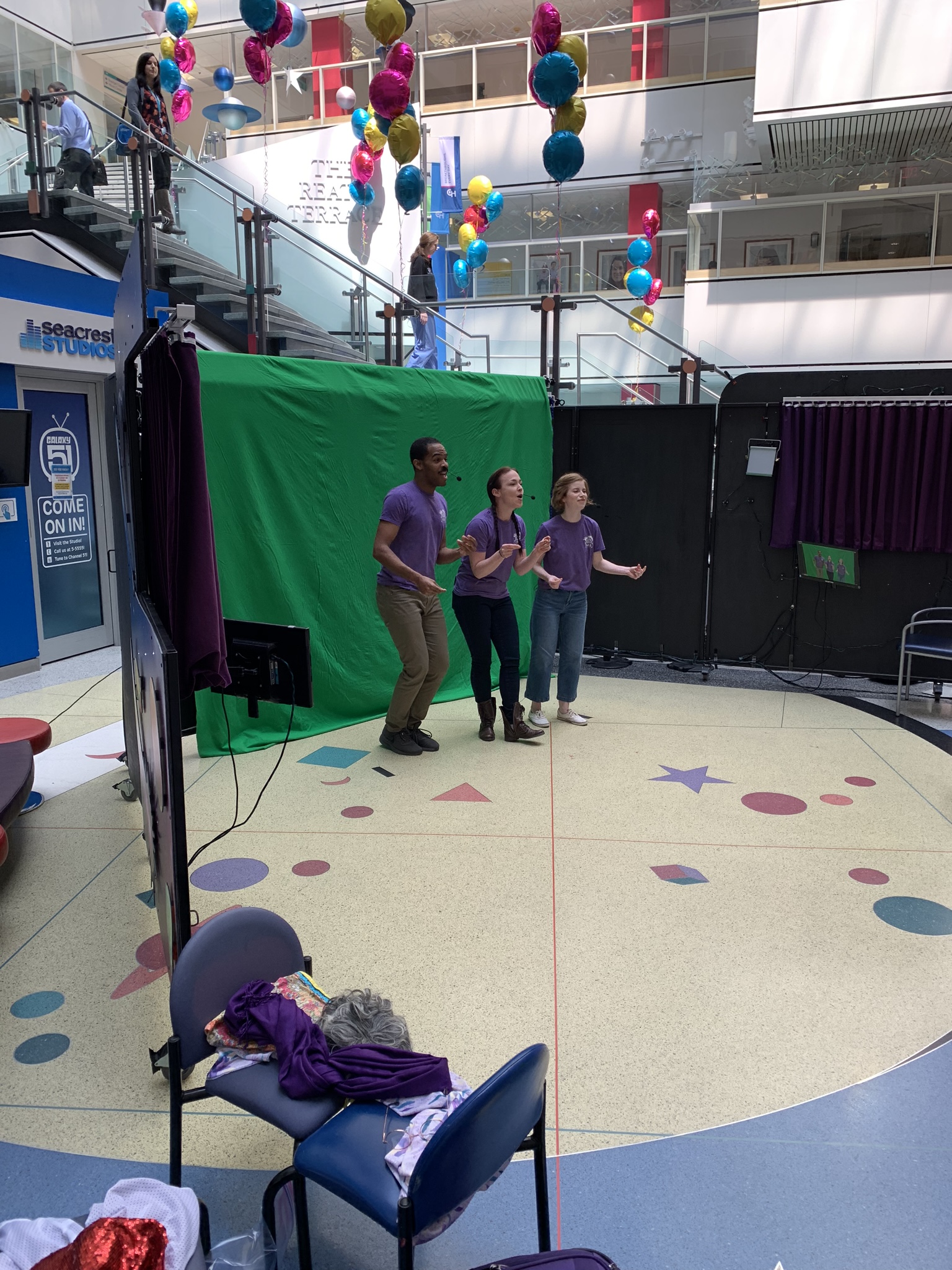 Actors performing in front of a green screen
