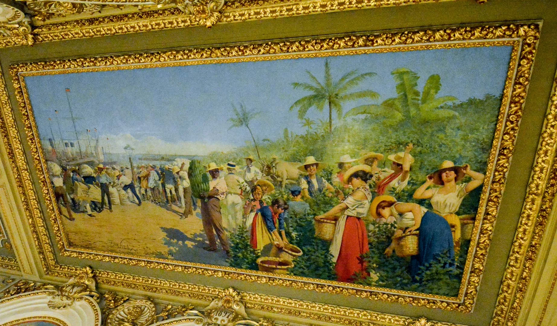 1.Banana bunch the man is holding are upside down 2.Coffee plants are growing on the beach—they actually grow in the mountains 3.The women picking the coffee look tall and fair-skinned, like Europeans, not like Costa Rican women at all 4.The men are working in some fancy clothes, right? That would not be the case in real life.