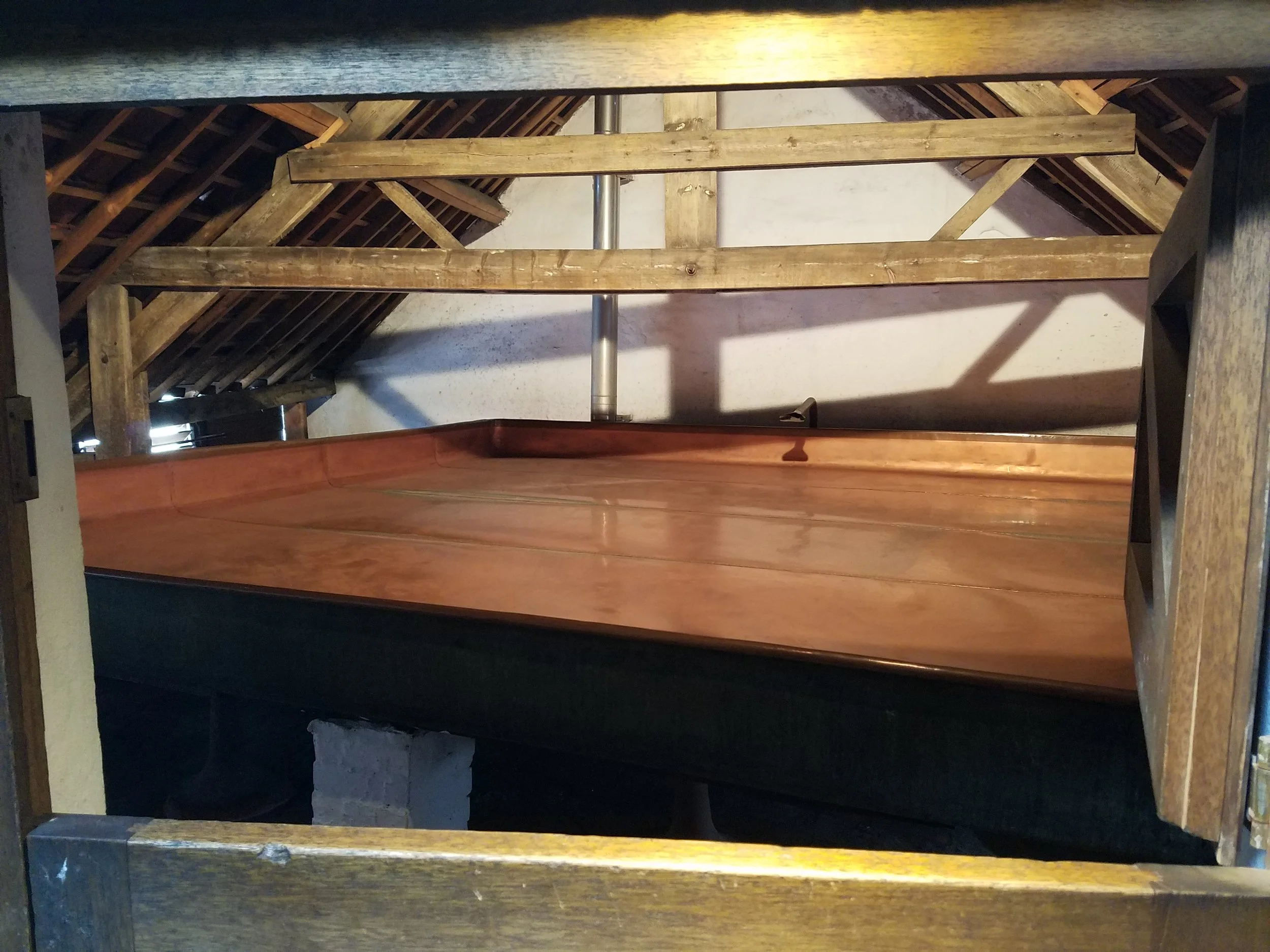 Cooling pan for the wort to reach room temperature and this is also when the natural yeast in the air mixes in. There were tons of spider webs in this room and we found out why…the spiders offer a natural protection from the insects the sweet smelling wort attract.