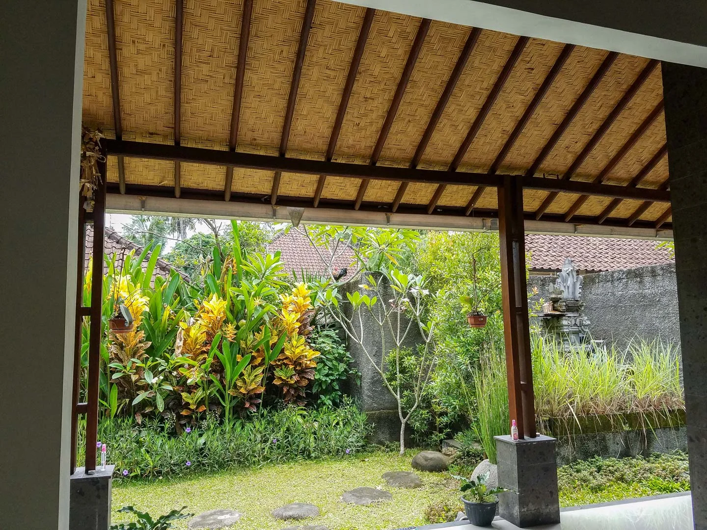 A peek at our enclosed garden and the home’s temple on the right