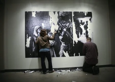 Ash Kyrie: Untitled Media Images (installation view), 2011. Copy paper & wheat paste. 70 x 100 in.