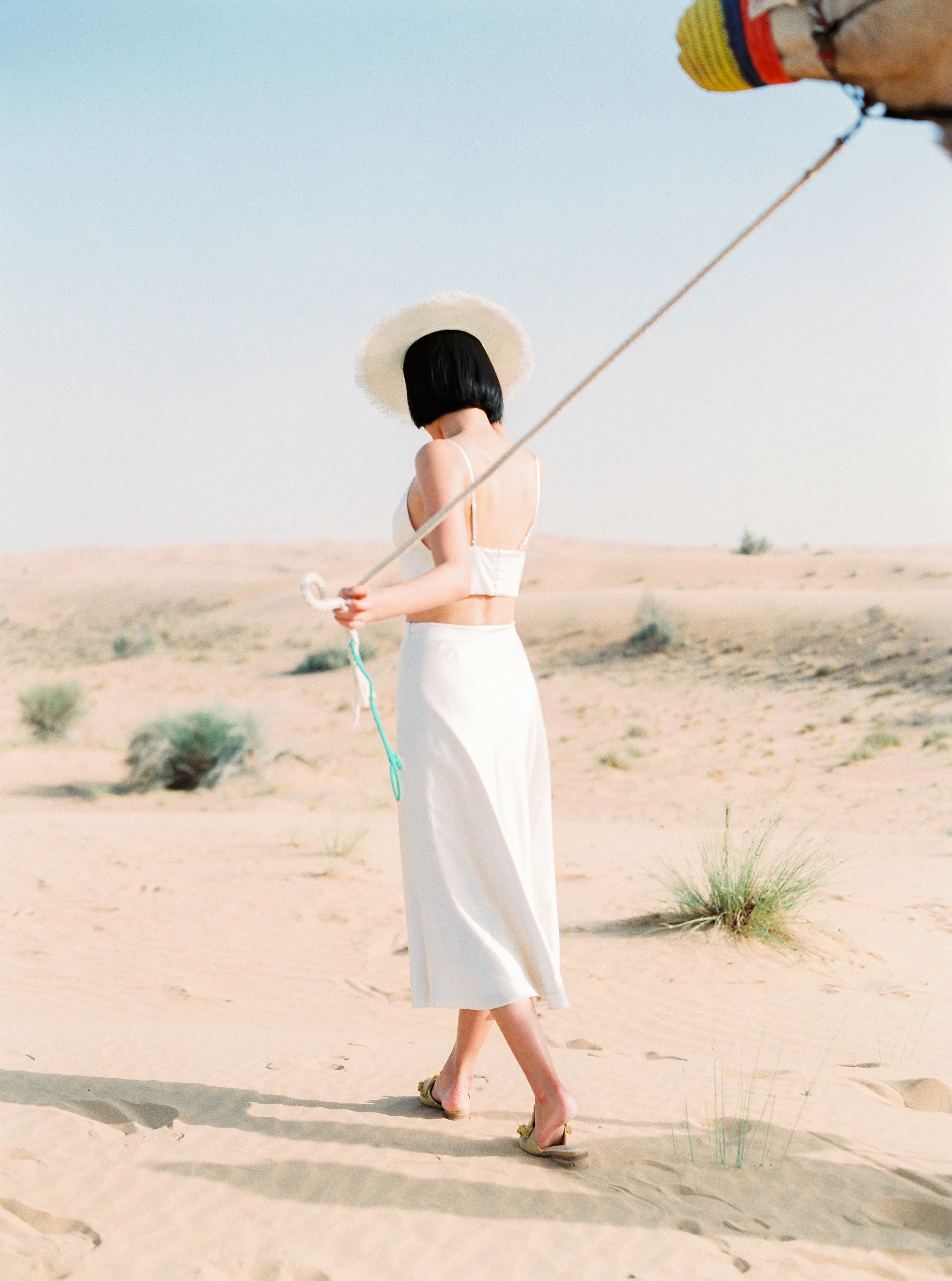 Maggie wears the Bustier Top and Midi Silk Skirt from her silk collection in her honeymoon shoot in Dubai. Photography: Maria Sundun Photography .