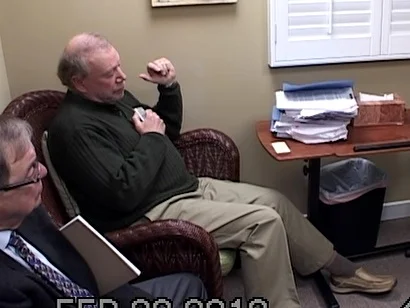 Photo: video still from the defense medical examination by two doctors.