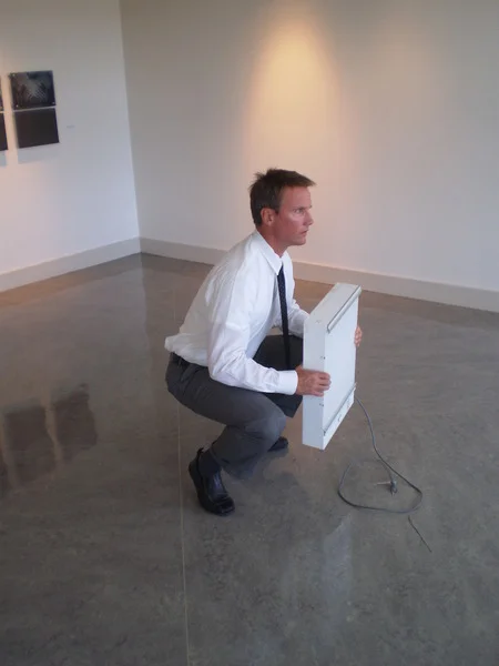 Photo: A chiropractor showing the jury the proper way the plaintiff needs to lift to protect his back while working in construction. Problem is he has a knee injury too. So now the jury can see the dilemma.