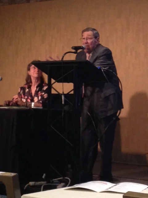 Photo: Gary Pillersdorf doing his thing at the Belli seminar with Linda Atkinson looking adoringly on.