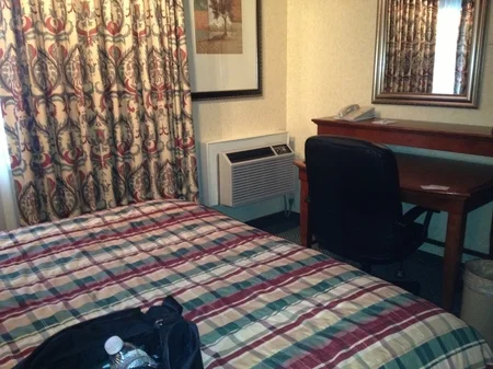 Photo: the dark, dank room with loud heater box in the corner.