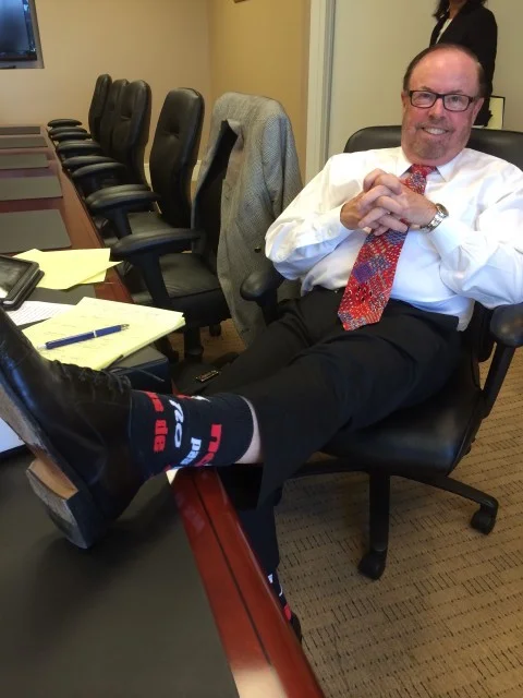 Photo: Paul Stritmatter. Showing off his cool socks. Right before we walked out of a mediation earlier in the month.
